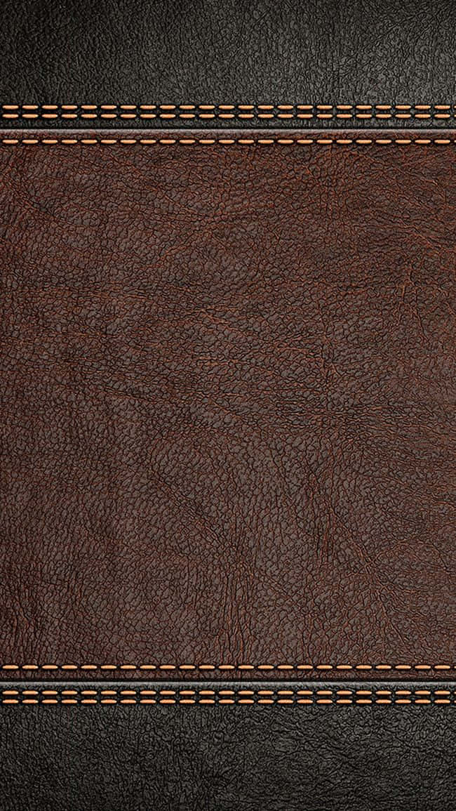 texture 桌布 壁紙 — 深棕色皮革的特寫，帶有紋理粒面和深色邊緣部分的對比橙色縫線。