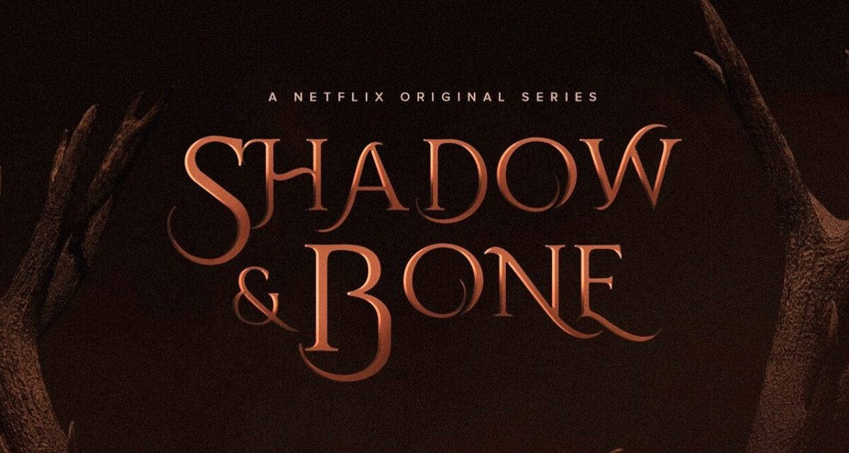 shadow 桌布 壁紙 — 深棕色背景上，深色多節樹枝框住優雅銅色襯線標題「Shadow & Bone」。