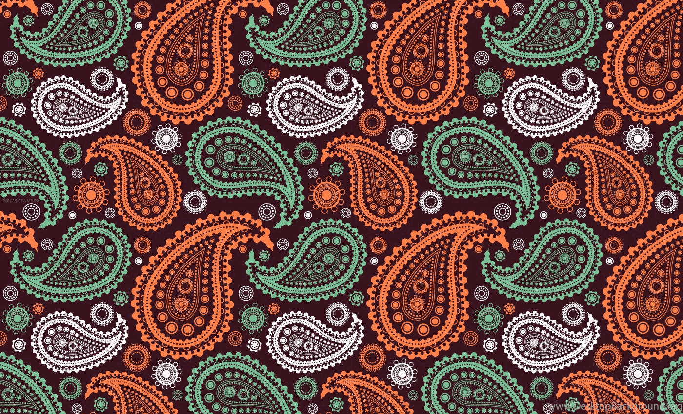 Paisley 桌布 壁紙 — 深棕色背景上充滿活力的佩斯利圖案，帶有橙色、綠色和白色圖案。