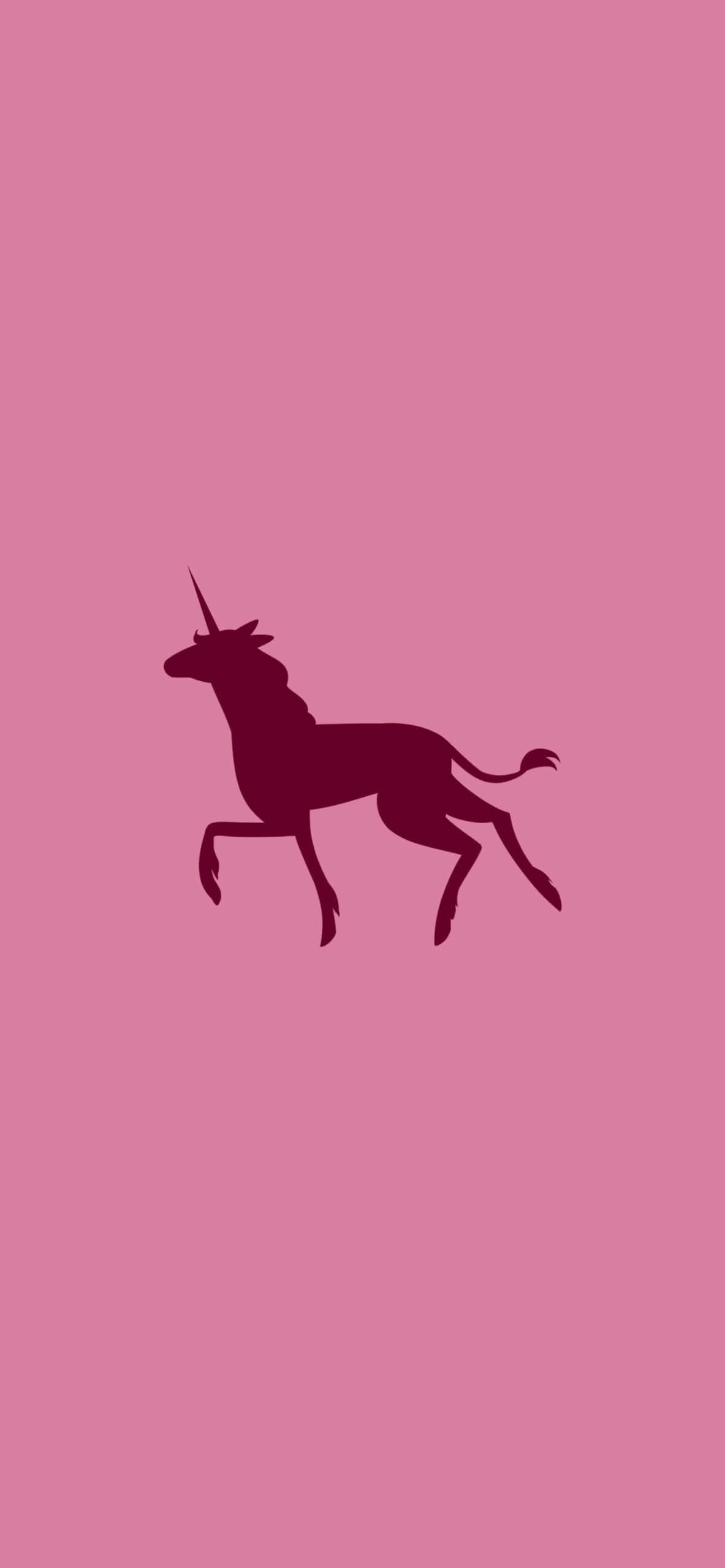 Minimalist Pink 桌布 壁紙 — 深洋紅色獨角獸剪影在純粉紅色背景上優雅地跳躍。