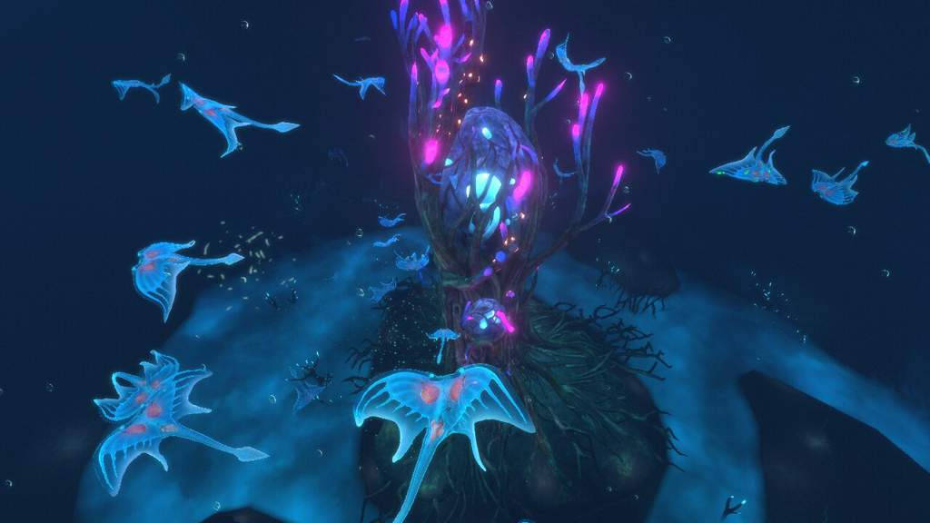 ghost leviathan 桌布 壁紙 — 深海深淵中，一個發光的紫色珊瑚礁充滿了生物發光的藍色水母。