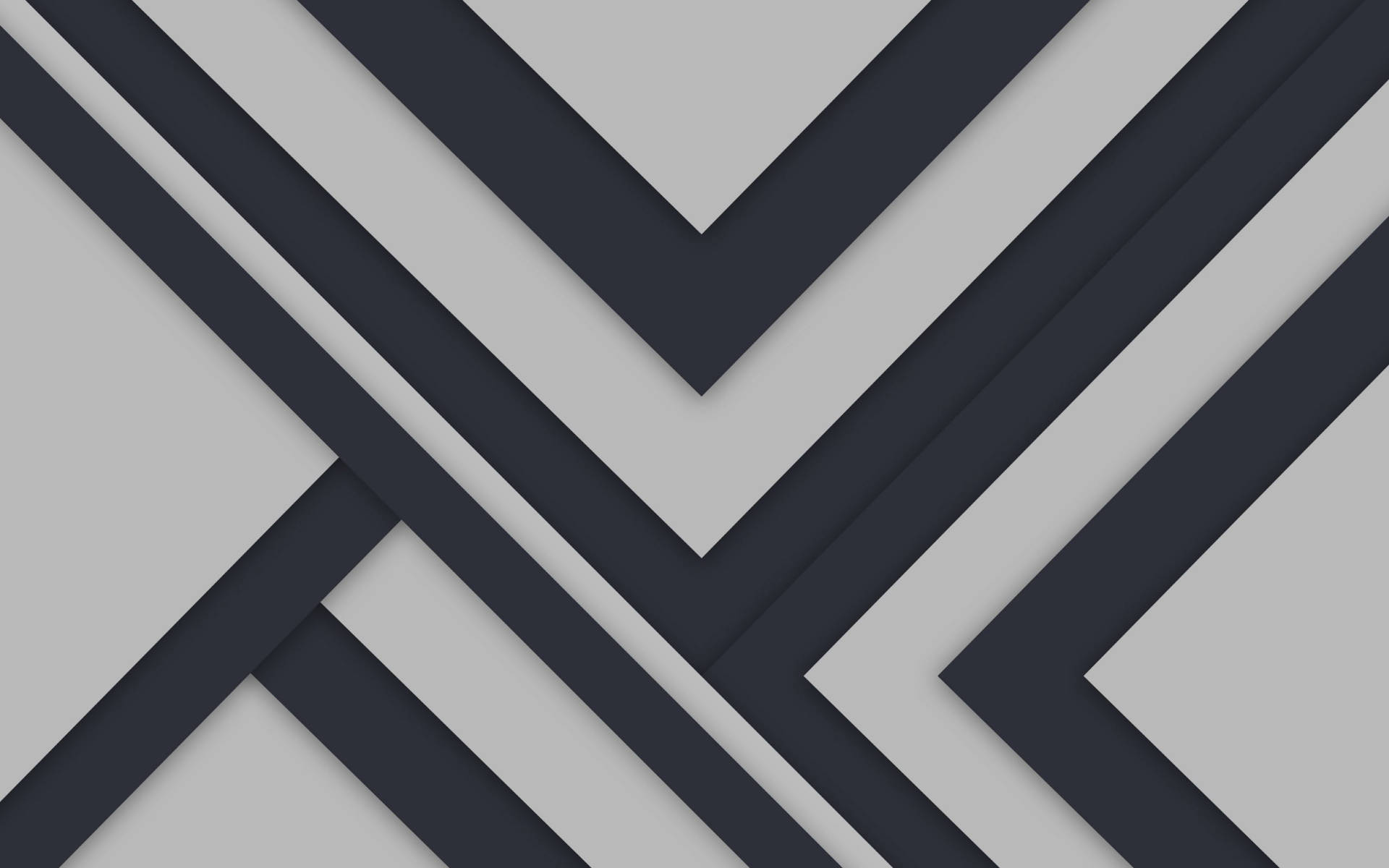 Android Material Design 桌布 壁紙 — 深灰色和淺灰色條紋層疊的幾何人字形圖案，營造出現代抽象構圖。