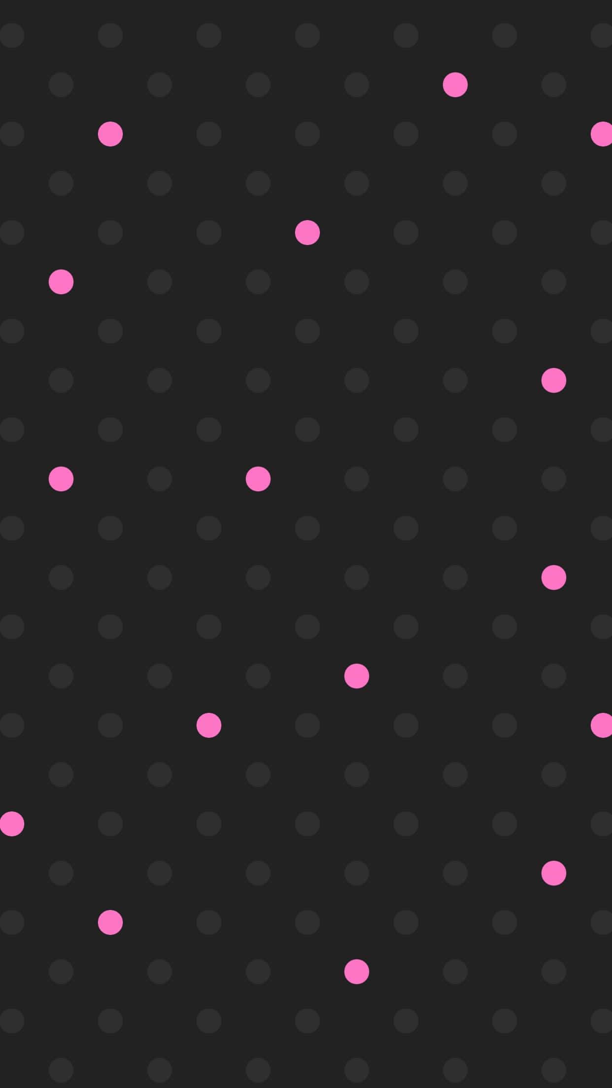 dots 桌布 壁紙 — 深灰色壁紙，帶有微妙的灰色圓點網格和散落的亮粉色圓點，營造出現代簡約的圖案。