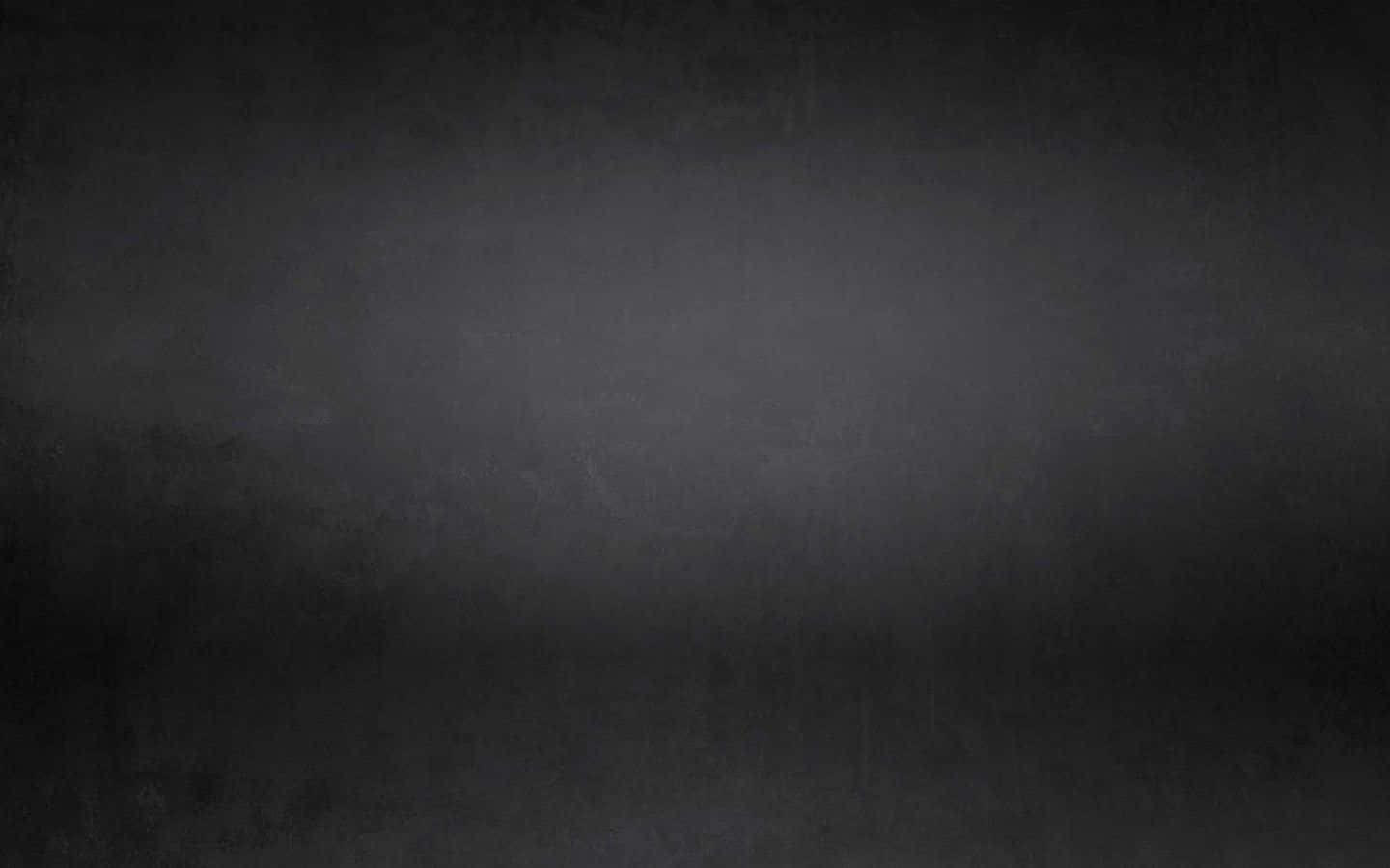 Dark Grunge 桌布 壁紙 — 深灰色的平滑漸變，帶有細微紋理，從深陰影逐漸過渡到柔和的中間色調。