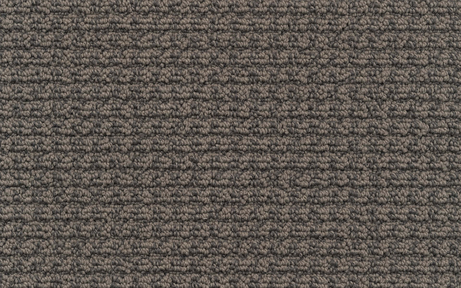 Carpet 桌布 壁紙 — 深灰色紋理地毯的特寫，具有一致的編織圖案和微妙的色調變化。