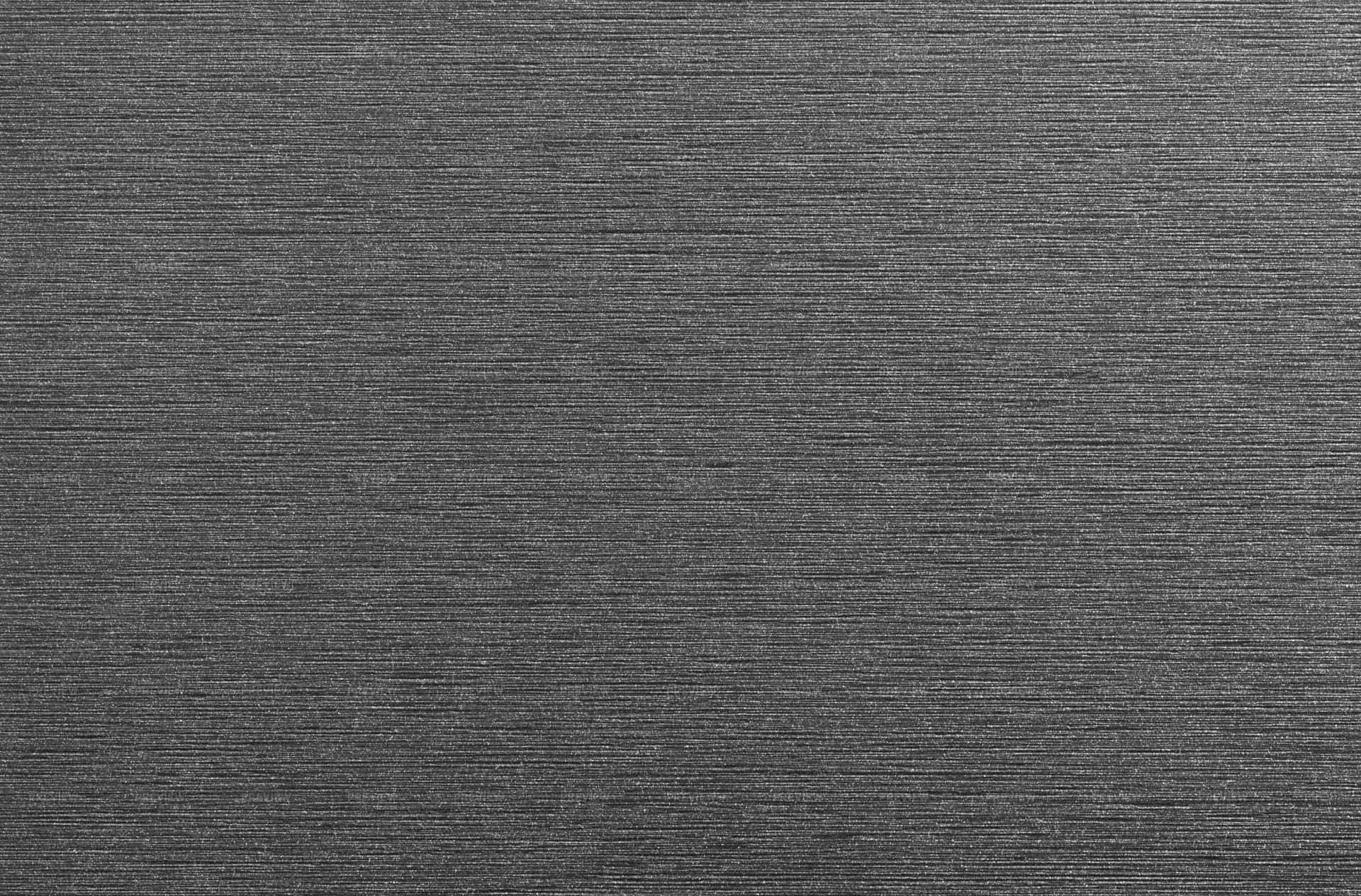 Grey Texture 桌布 壁紙 — 深灰色紋理布料的特寫，帶有細微的水平編織線條，形成微妙的條紋圖案。
