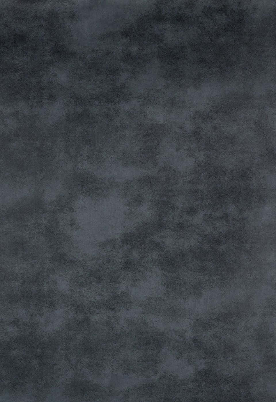 texture 桌布 壁紙 — 深灰色紋理表面的特寫，帶有類似老化石頭或布料的斑駁圖案。
