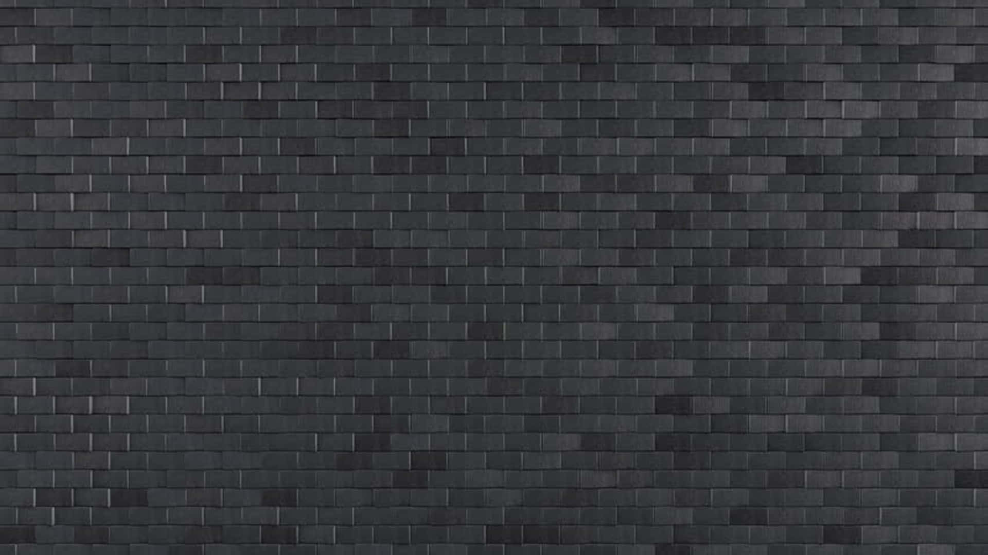 Brick 桌布 壁紙 — 深灰色編織紡織品的特寫，具有一致的網格圖案和微妙的紋理變化。