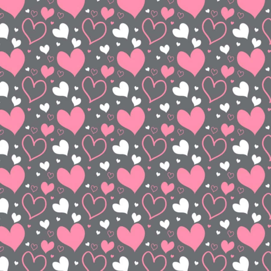 Heart Pattern 桌布 壁紙 — 深灰色背景上重複的粉紅色和白色心形圖案，營造出甜美浪漫的桌布。