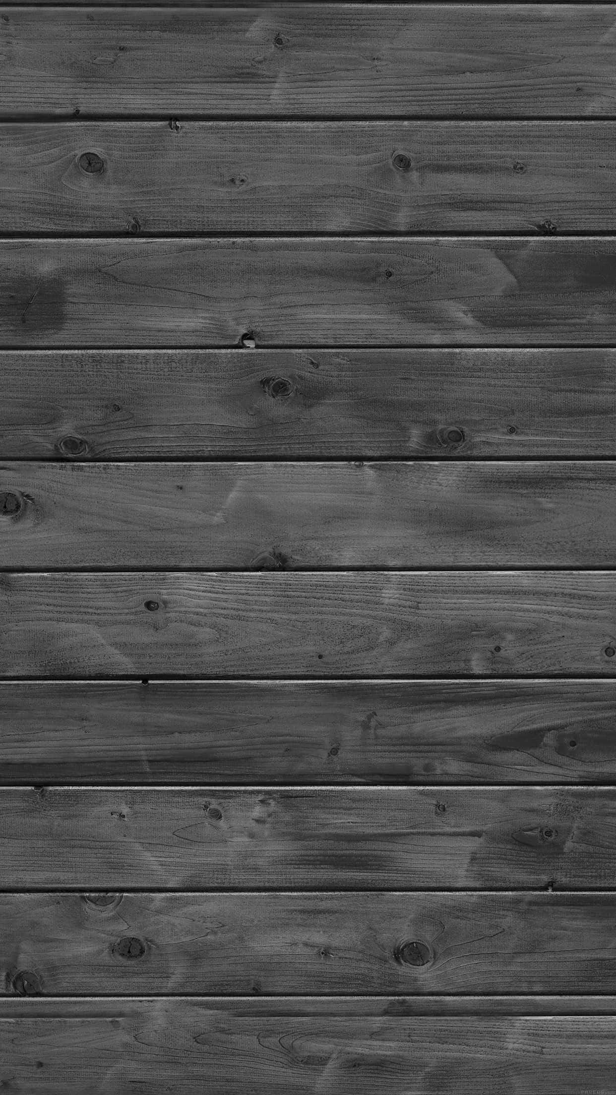 planks 桌布 壁紙 — 深灰色風化木板水平排列，可見木紋、節疤和微妙的紋理變化。