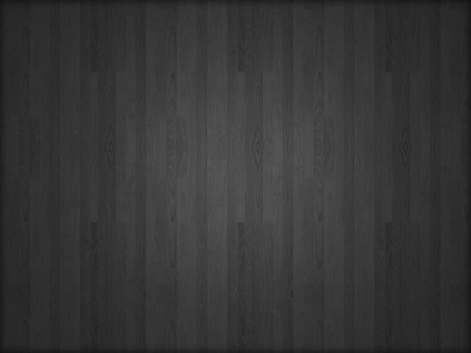 Dark Grey 桌布 壁紙 — 深炭色木地板，帶有細微木紋圖案和柔和漸變燈光。