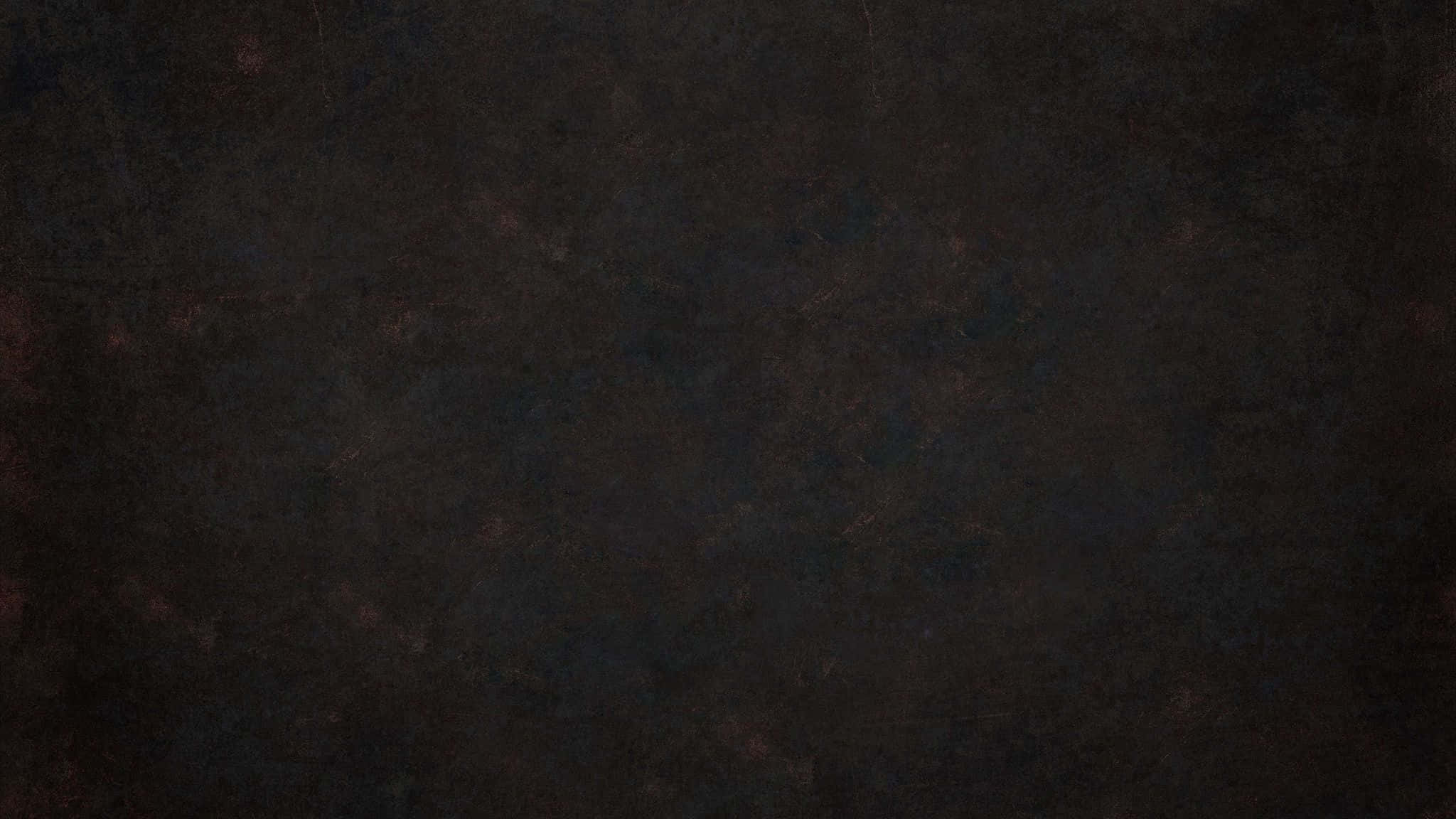 Dark Grunge 桌布 壁紙 — 深炭色表面上帶有細微紅色斑點和斑駁圖案的深色紋理背景。