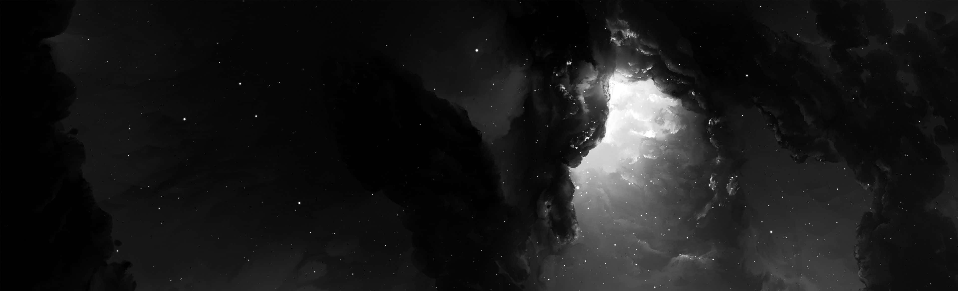 Best Monitor 桌布 壁紙 — 深空中，戲劇性的單色宇宙雲層框住璀璨星野。