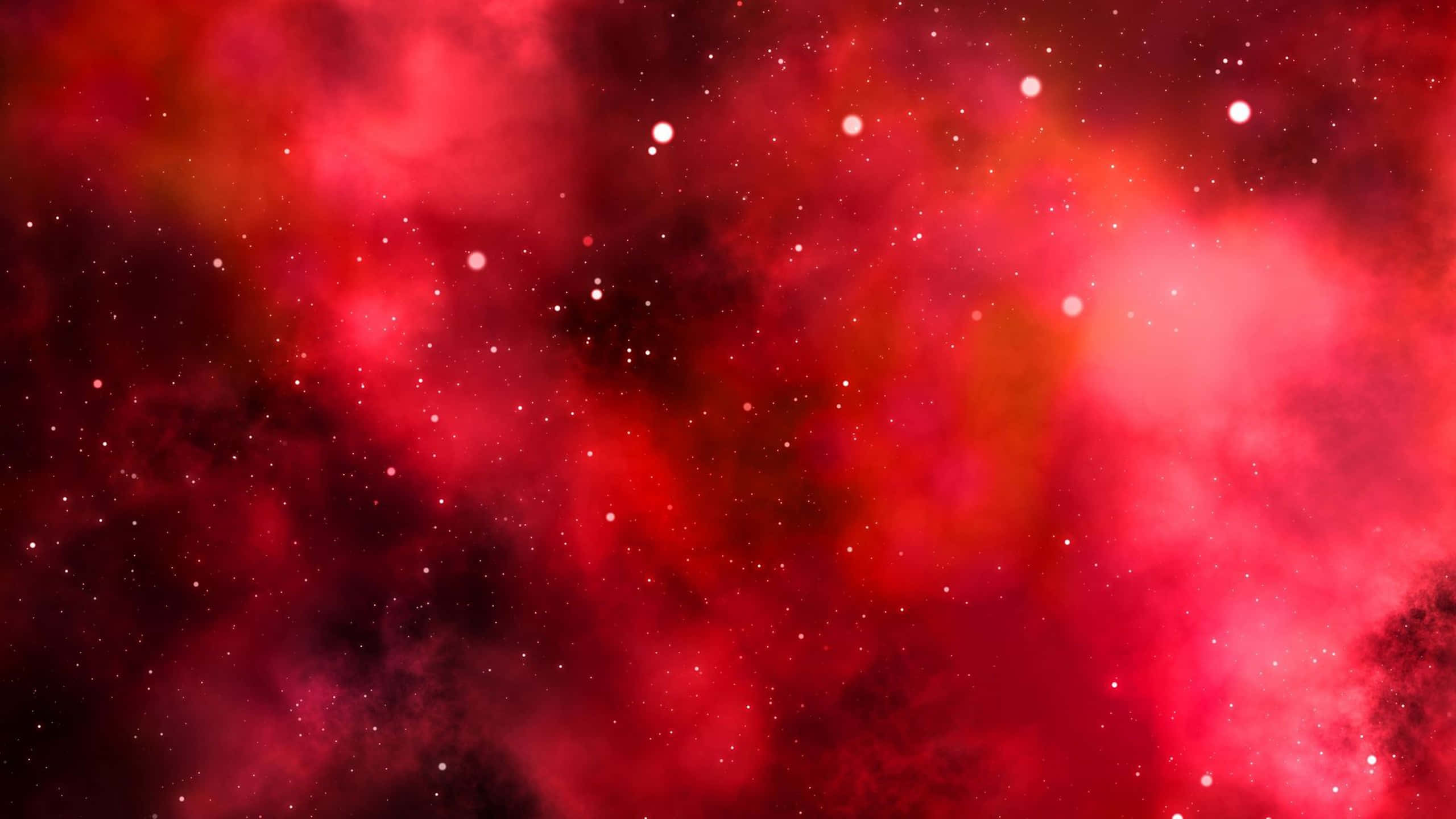 Red Galaxy 桌布 壁紙 — 深空中帶有發光恆星和旋轉宇宙塵埃的鮮豔紅色宇宙星雲。