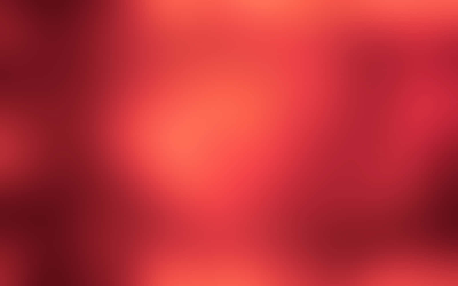漸層 桌布 壁紙 — 深紅色和暖橙色的柔和漸變，融合成夢幻般的抽象模糊效果。