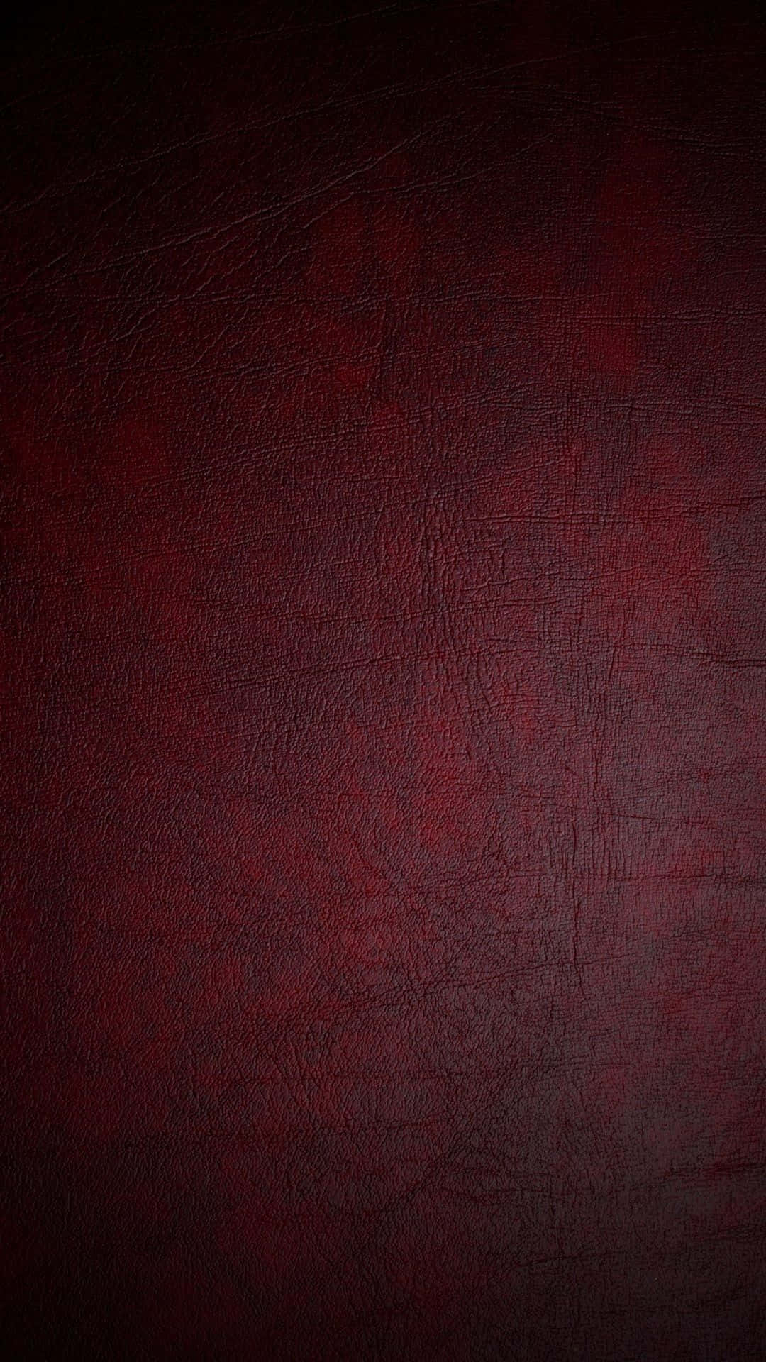texture 桌布 壁紙 — 深紅色紋理皮革的特寫，帶有細微刮痕和天然紋理圖案。
