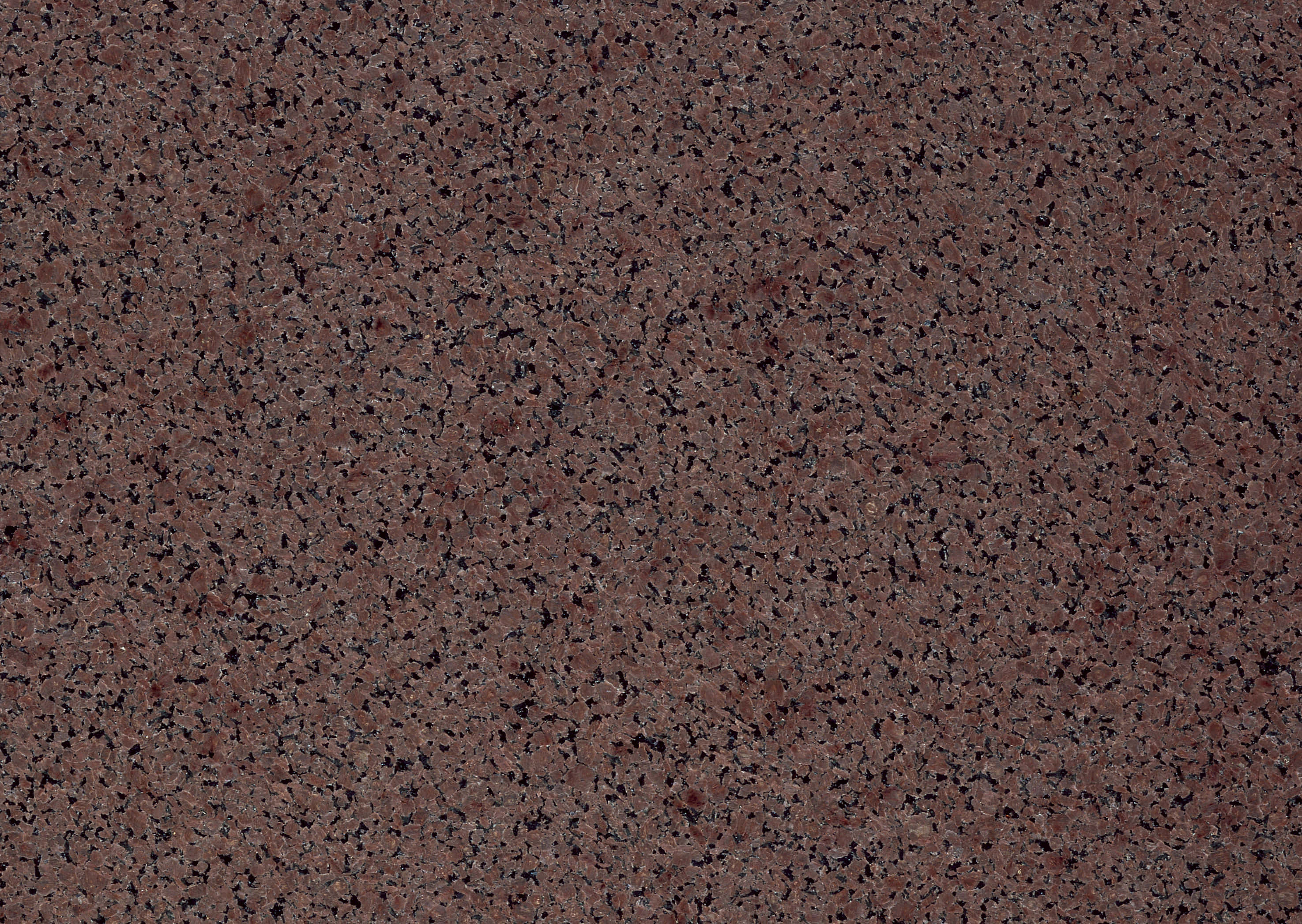 Granite 桌布 壁紙 — 深紅褐色花崗岩的特寫，帶有斑駁的黑白礦物顆粒。