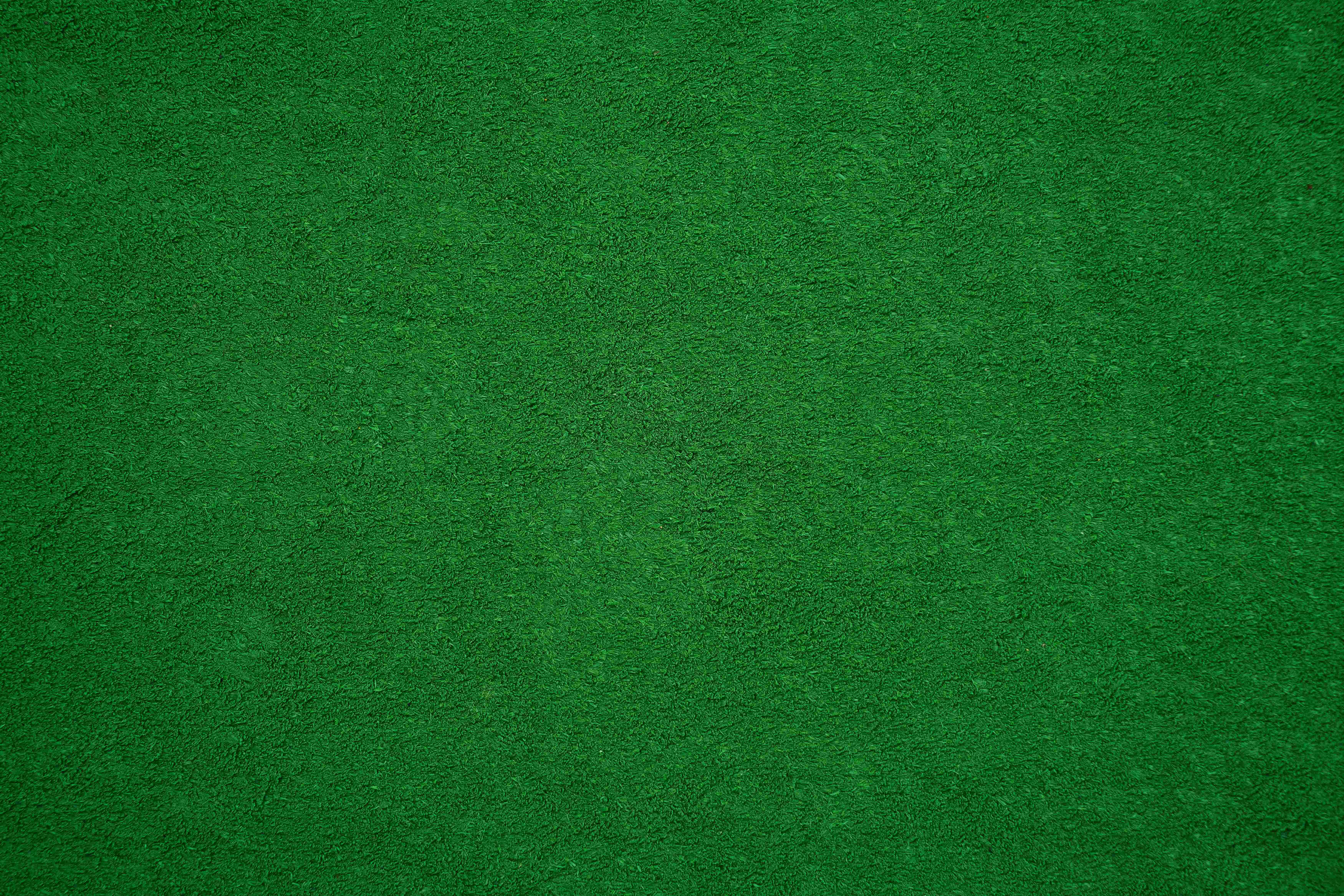 Green Texture 桌布 壁紙 — 深綠色紋理表面的特寫，帶有微妙的色調變化和細粒紋理。
