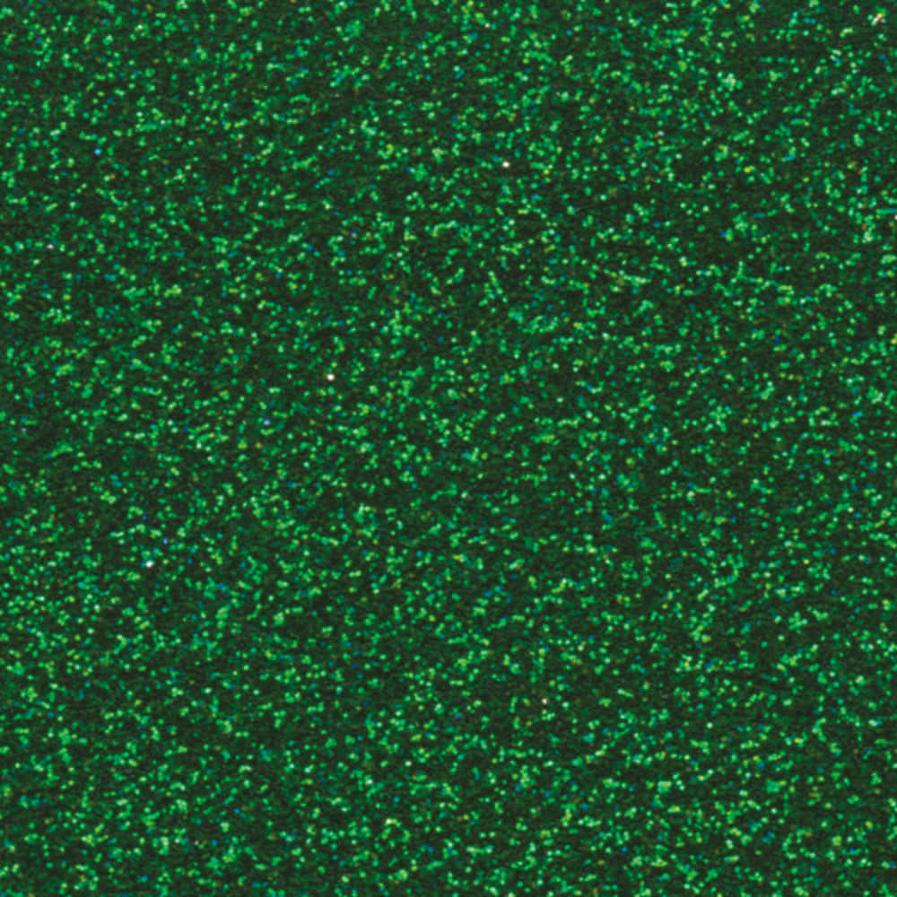 Green Glitter 桌布 壁紙 — 深綠色表面上散落著閃爍的綠色亮粉顆粒，形成閃閃發光的紋理特寫。