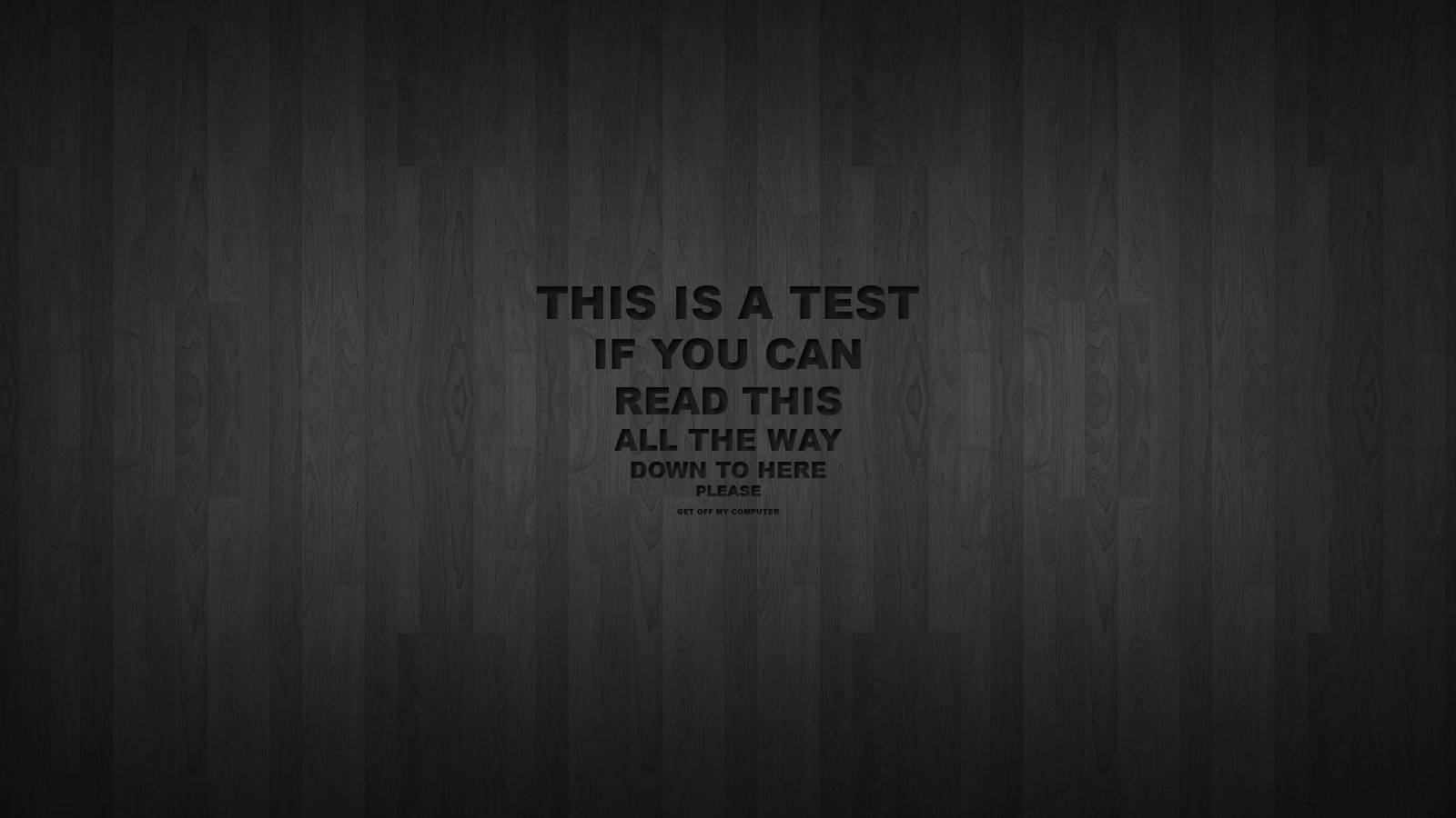 vlone computer 桌布 壁紙 — 深色木紋背景，中央粗體文字顯示「THIS IS A TEST IF YOU CAN READ THIS ALL THE WAY DOWN TO HERE PLEASE」