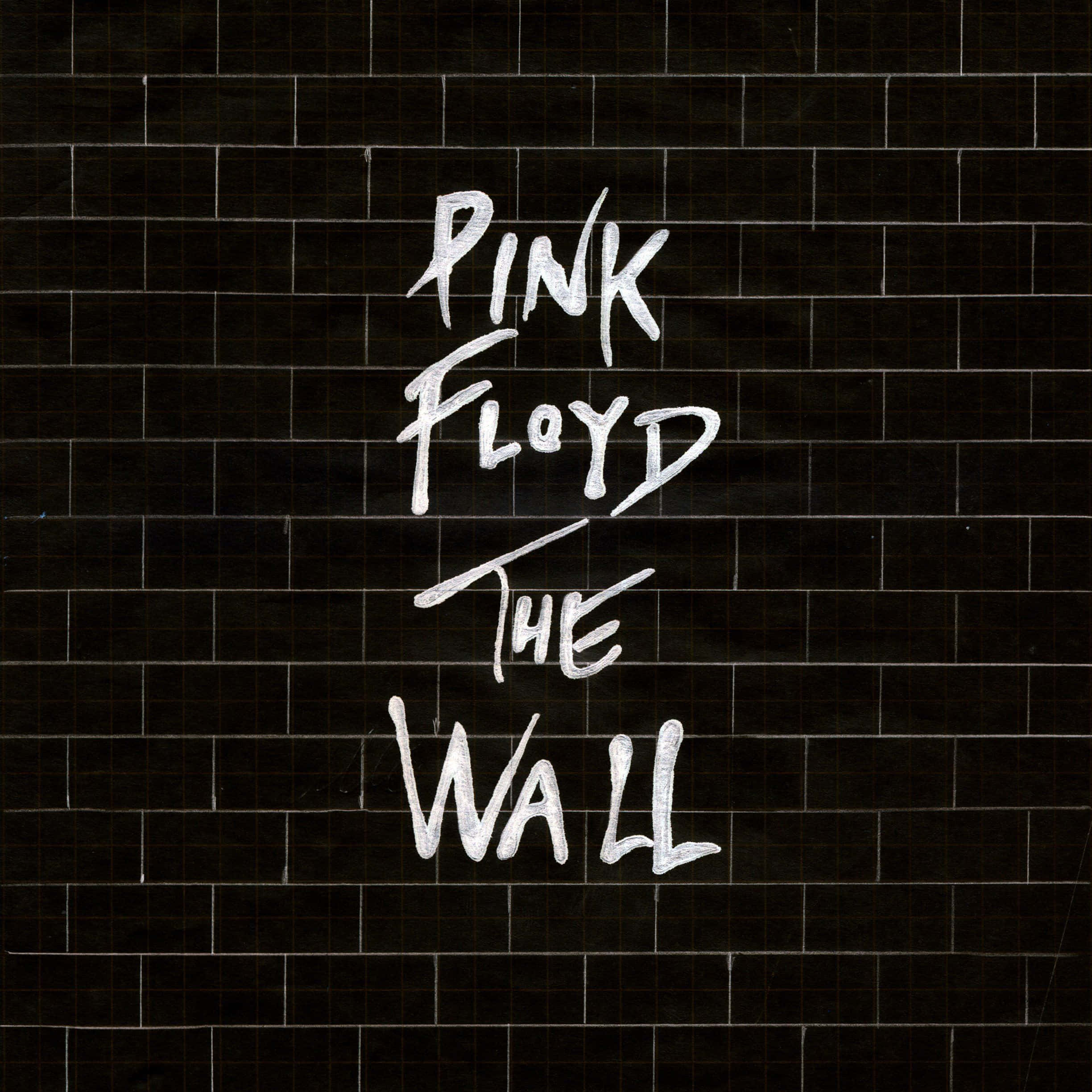 桌布 壁紙 — 深色瓷磚牆上寫有白色塗鴉風格文字 Pink Floyd The Wall。