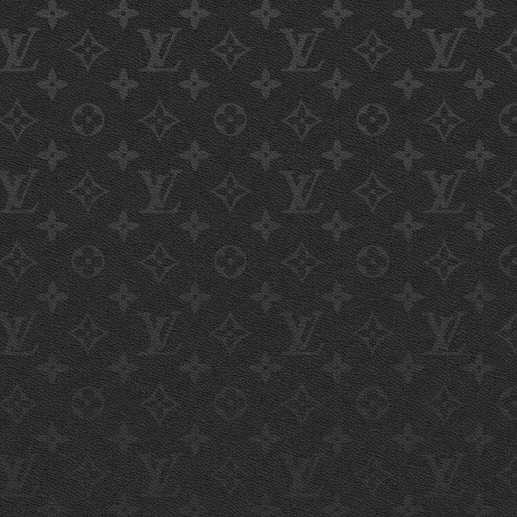 Monogram Desktop 桌布 壁紙 — 深色紋理壁紙，帶有重複的字母組合圖案，呈現微妙的灰色調。