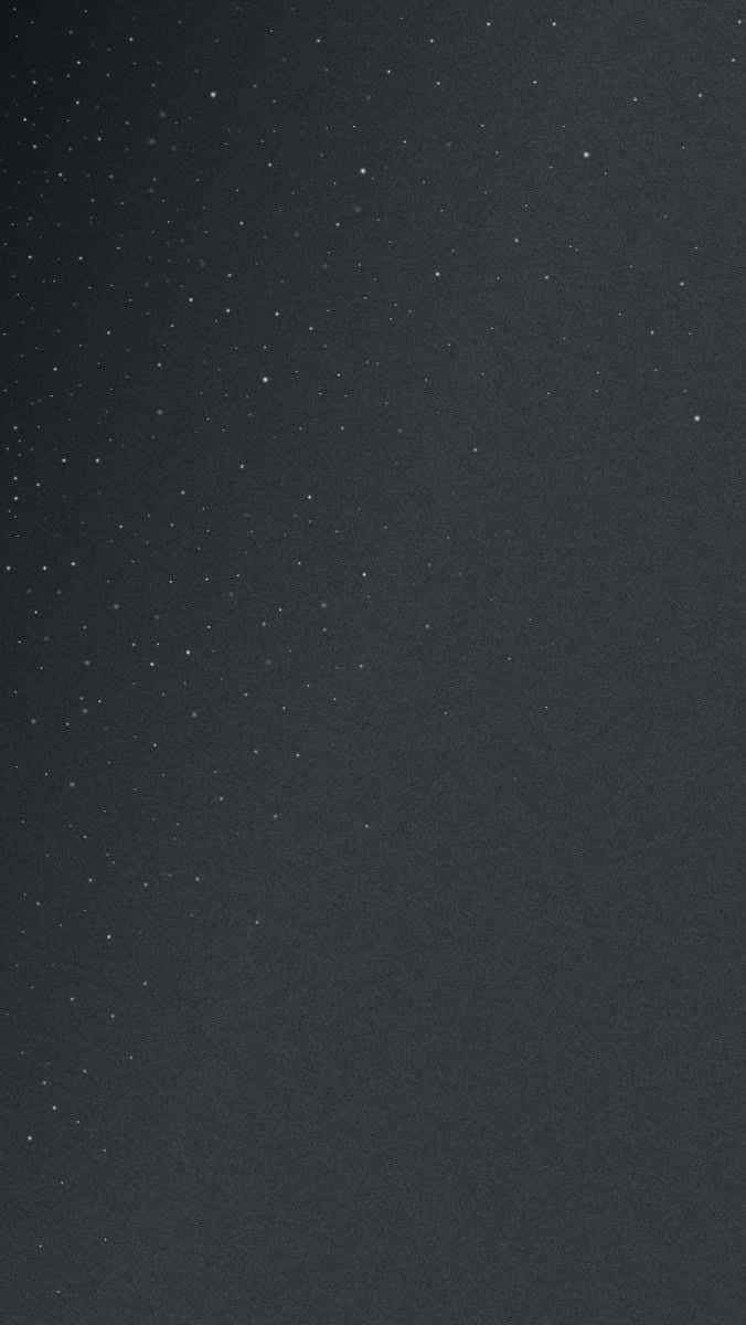 簡約 桌布 壁紙 — 深色紋理夜空點綴著微弱的白色星星，營造出極簡的天體場景。