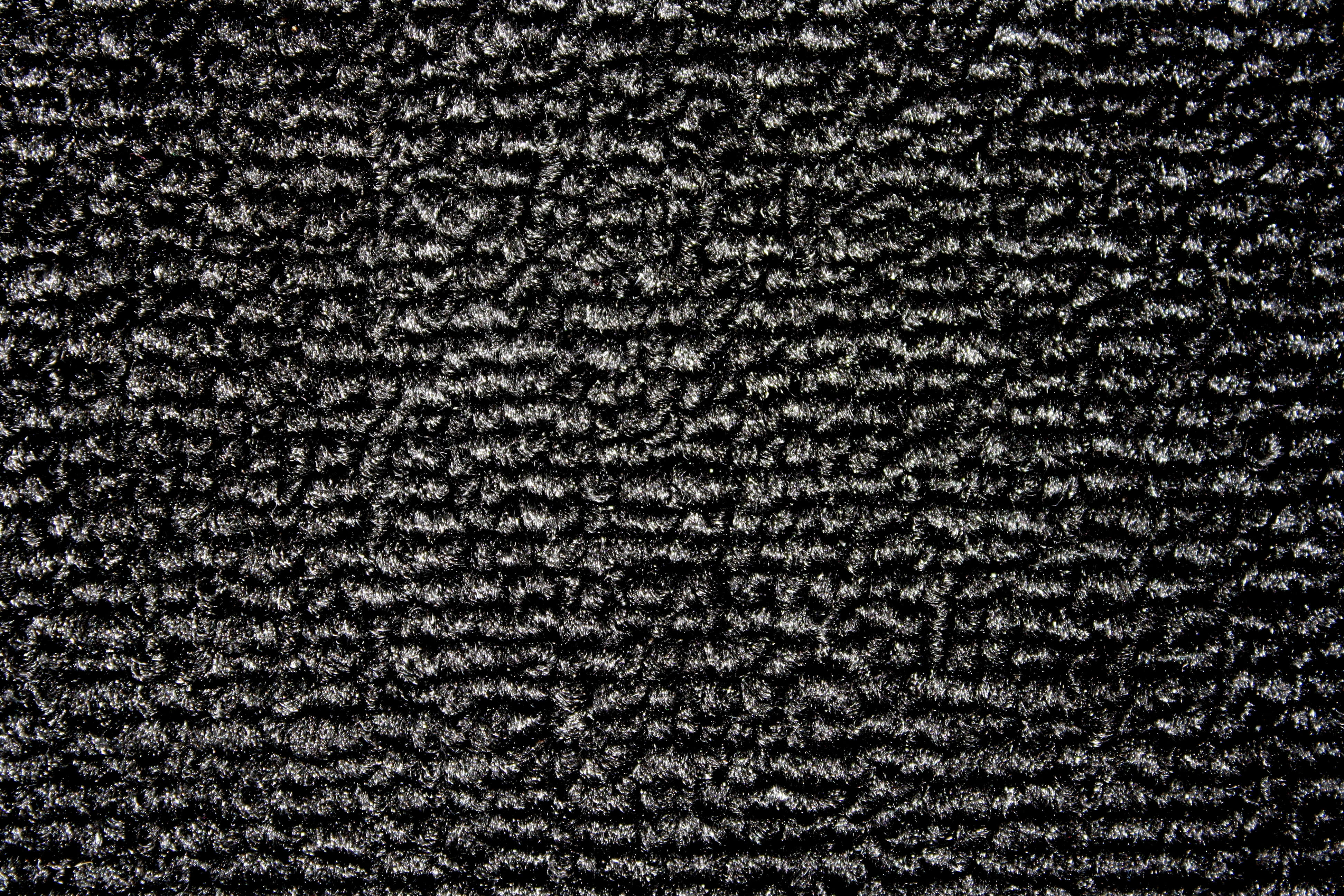 Carpet Texture 桌布 壁紙 — 深色紋理布料特寫，帶有細膩的銀色亮點，營造出豐富的觸感圖案。