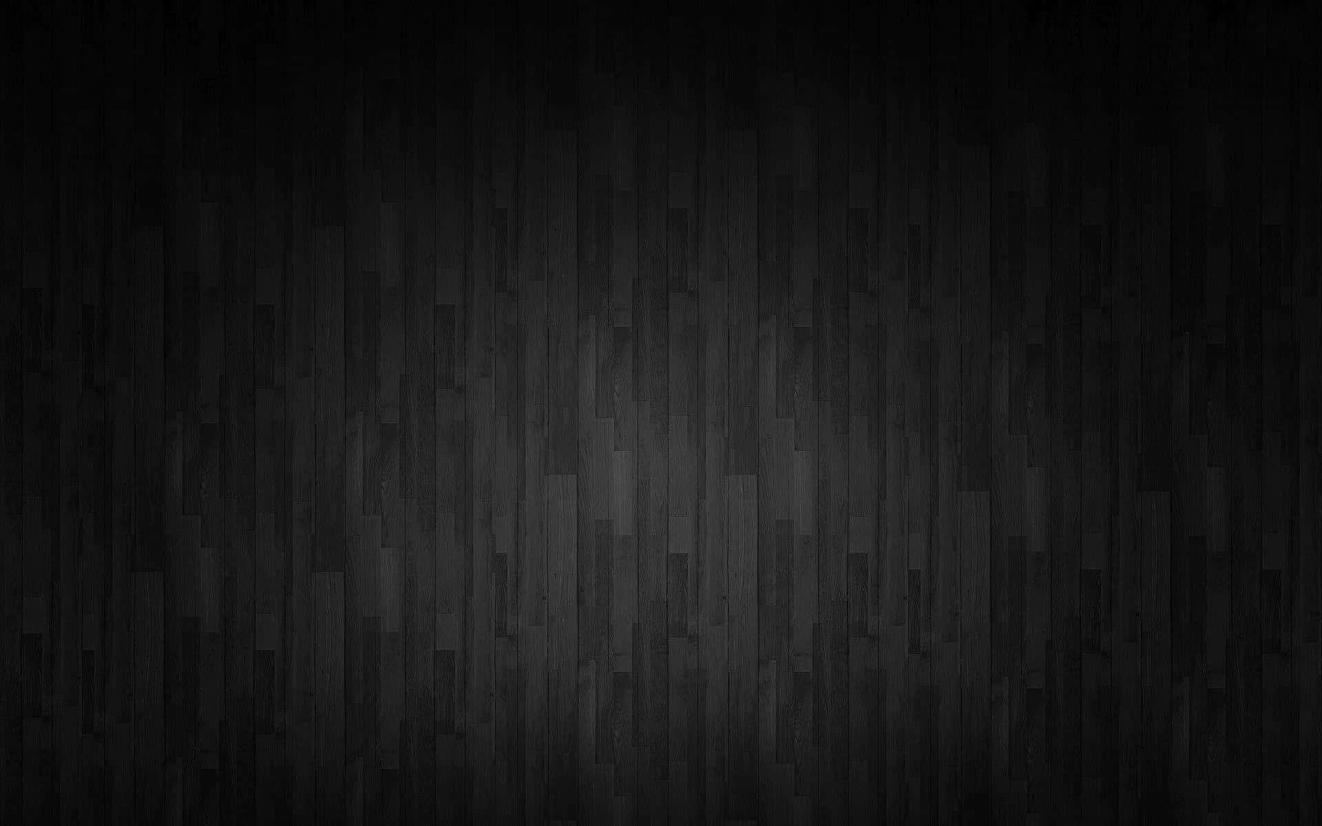 Dark Grey 桌布 壁紙 — 深色紋理木板，表面帶有微妙的漸變燈光。
