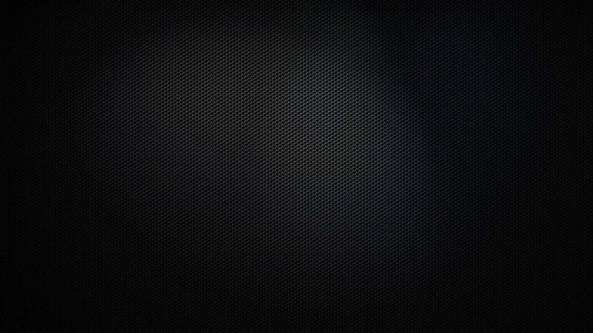 Plain Black Desktop 桌布 壁紙 — 深色紋理背景，帶有微妙的漸變和細點圖案，從黑色漸變到接近黑色。