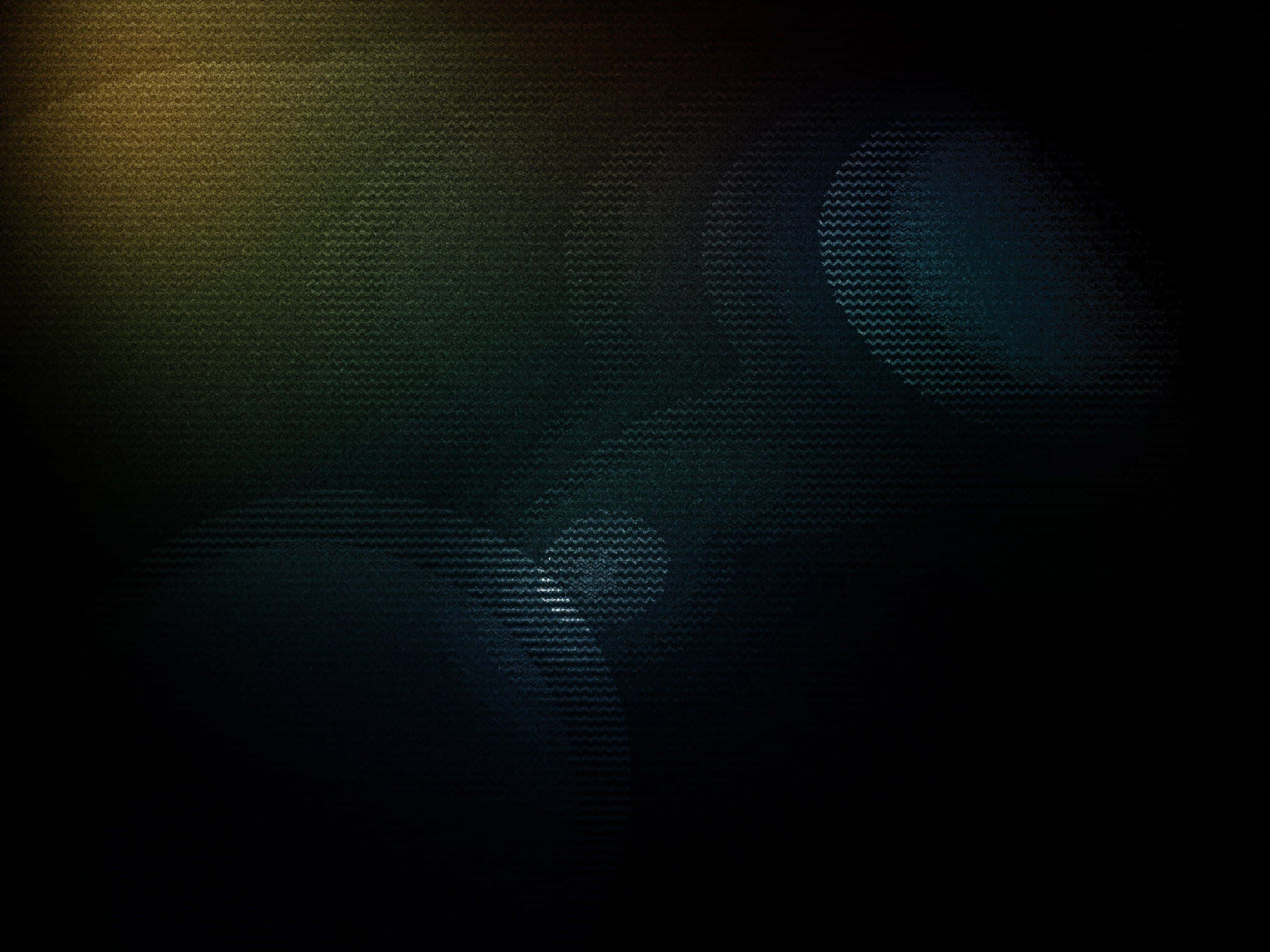 Dark Grunge 桌布 壁紙 — 深色紋理背景，帶有青綠色和金色調的發光鏡頭光暈，營造出陰鬱的氛圍效果。