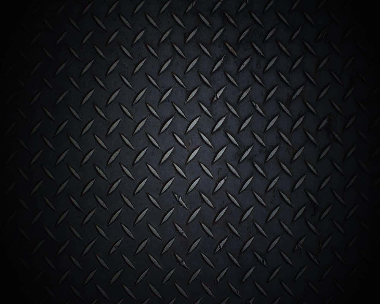 Diamond Plate 桌布 壁紙 — 深色紋理菱形板金屬的特寫，柔和光線突出其工業脊線。