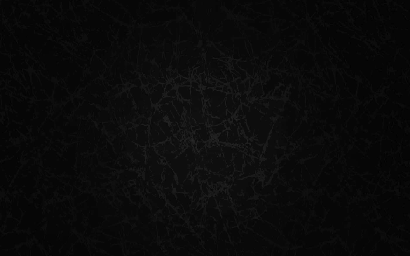 Plain Black Desktop 桌布 壁紙 — 深色紋理表面，帶有微妙的裂紋圖案，類似於老化皮革或破碎玻璃。