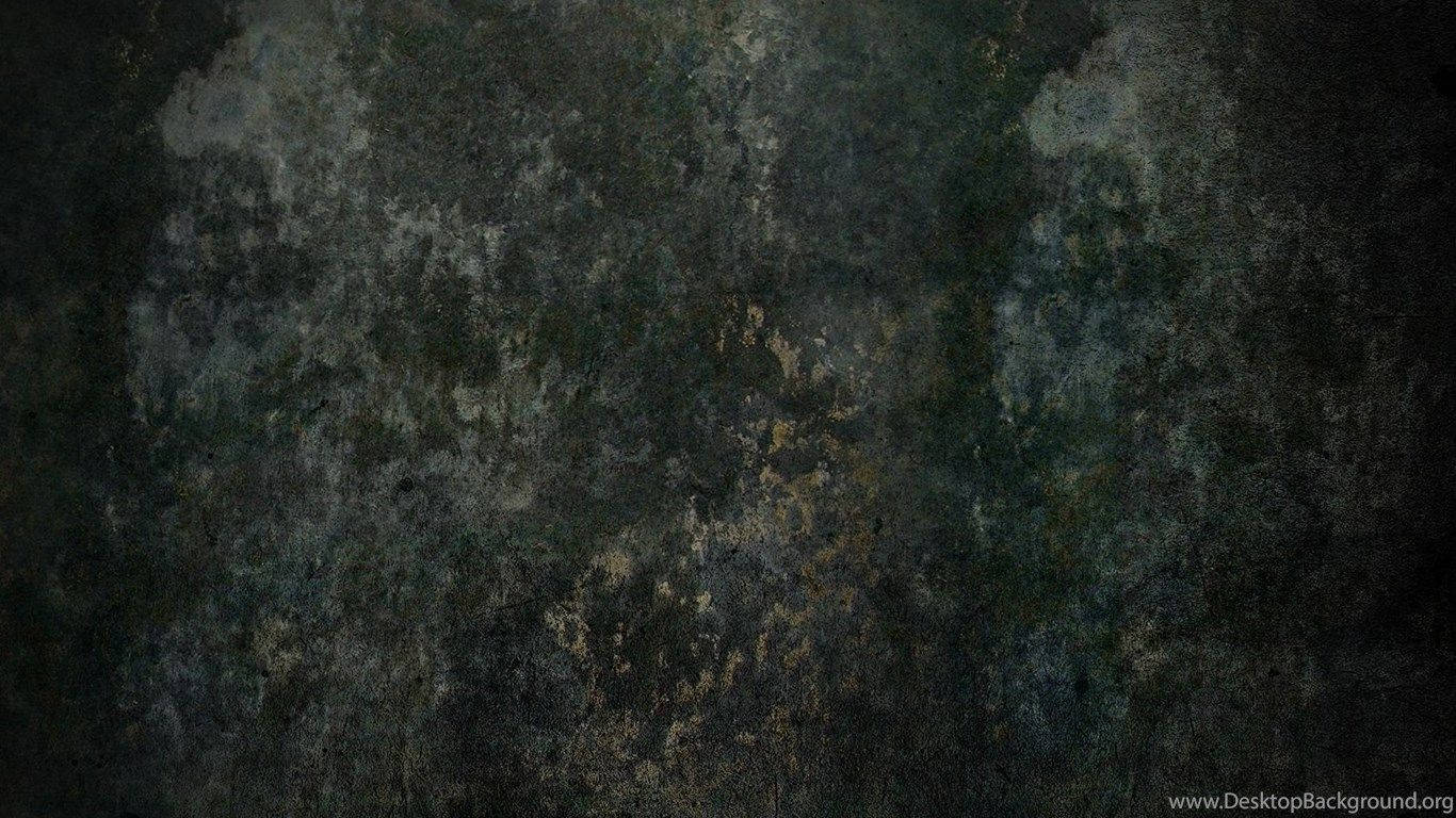 油漬搖滾 桌布 壁紙 — 深色紋理表面，帶有斑駁的灰藍色和金色斑塊，類似老化的金屬或石頭。