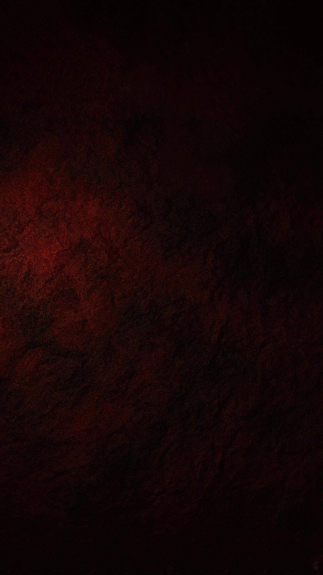 Screen 桌布 壁紙 — 深色紋理表面從左側散發出深紅色的光芒，營造出陰鬱的抽象背景。