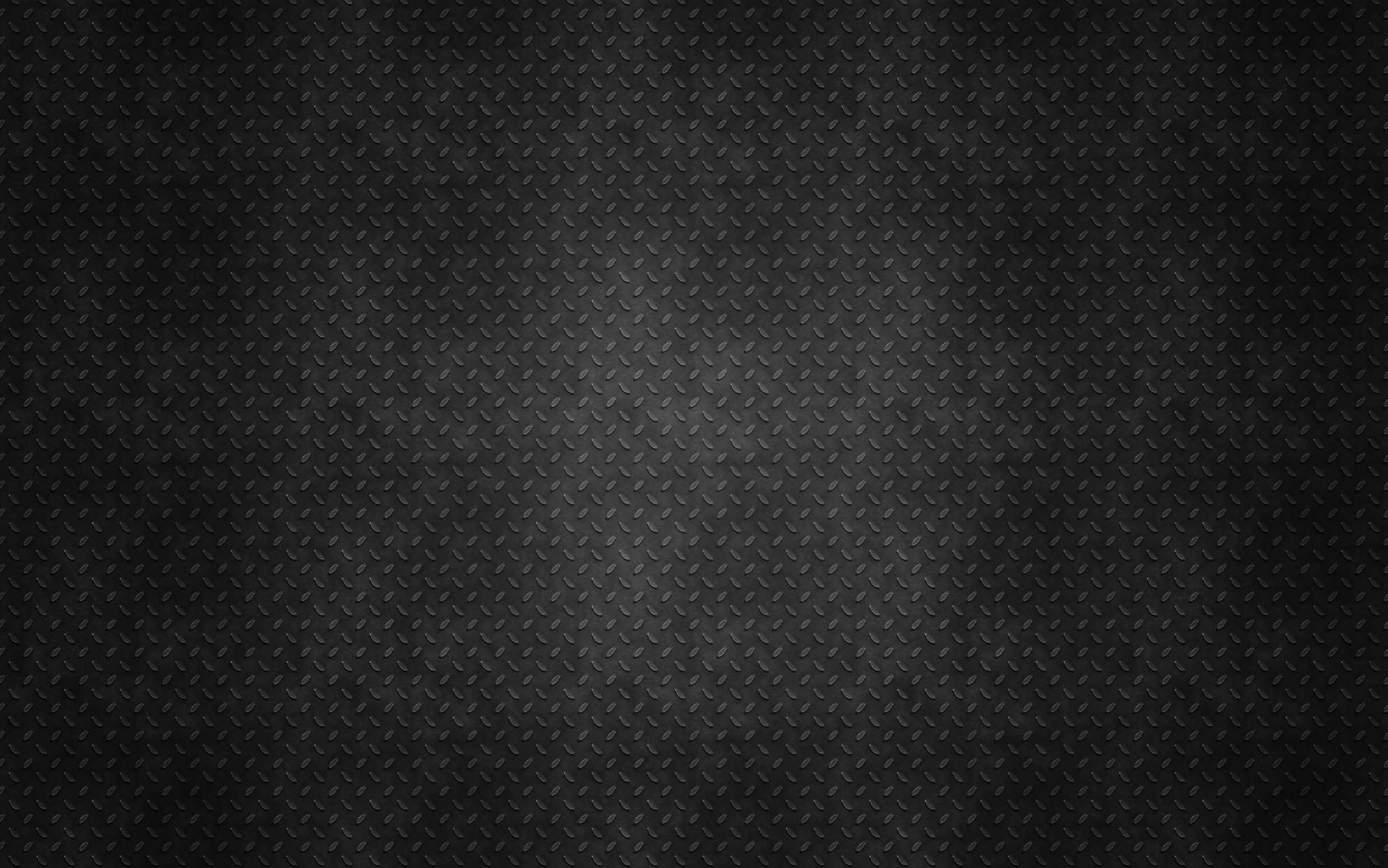Dark Textured 桌布 壁紙 — 深色紋理鑽石板金屬表面，帶有微妙的漸變照明。