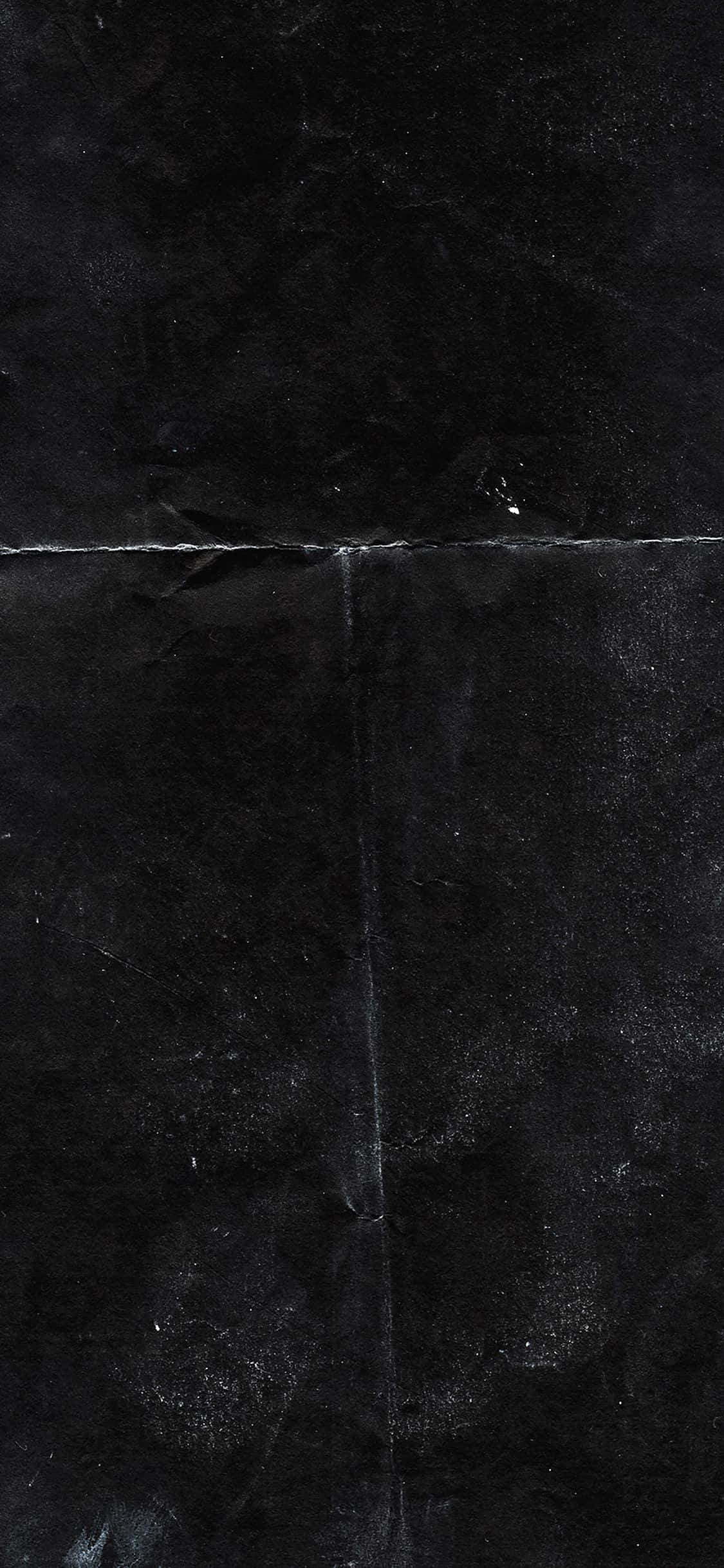 黑色 桌布 壁紙 — 深色紋理黑色大理石瓷磚的特寫，帶有細微的灰色紋理和可見的接縫。
