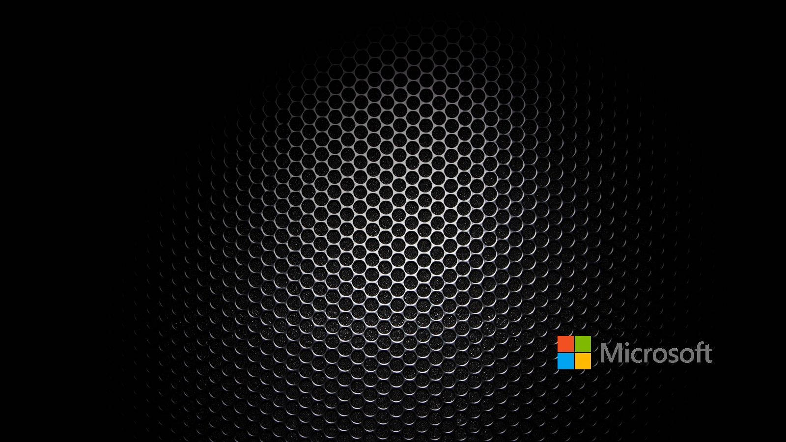 帶有Microsoft標誌的深色金屬六角形網格 — Microsoft 壁紙