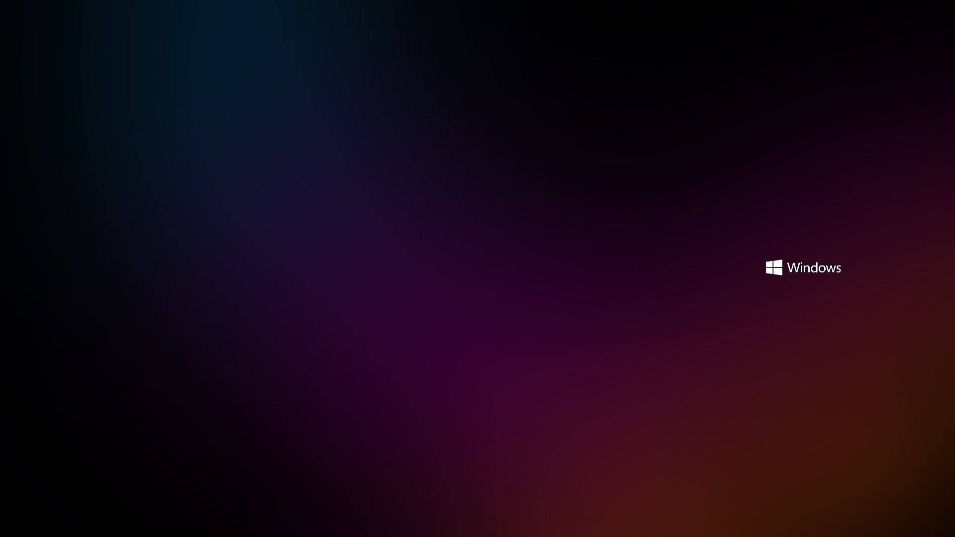 右下角帶有Windows標誌的深色漸變背景。 — Microsoft 壁紙