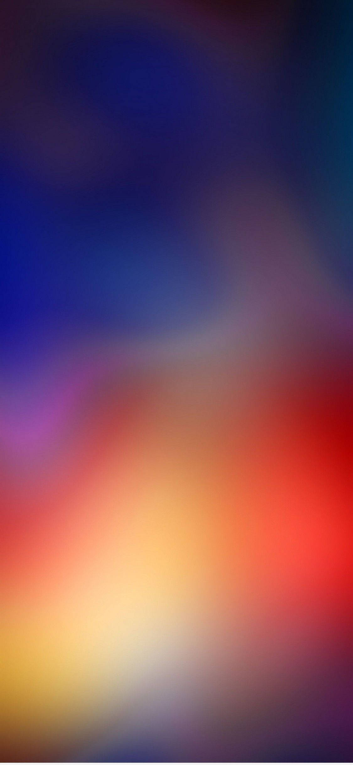 Screen 桌布 壁紙 — 深藍紫色柔和漸變，融入溫暖的紅橙色和黃色色調，營造出夢幻般的抽象背景。