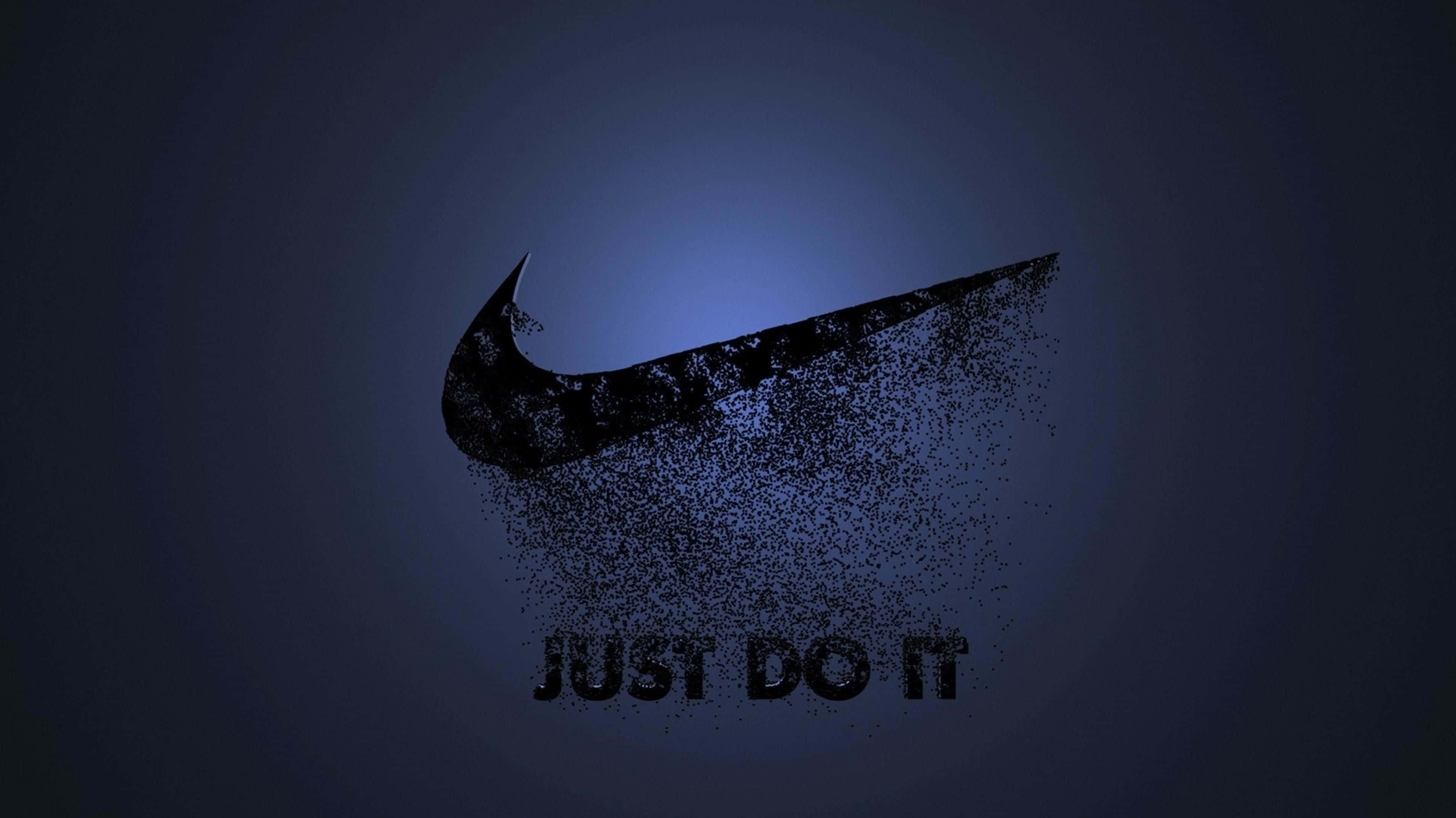 標誌 桌布 壁紙 — 深藍色Nike swoosh標誌在漸層背景上分解成粒子，下方有just do it文字。