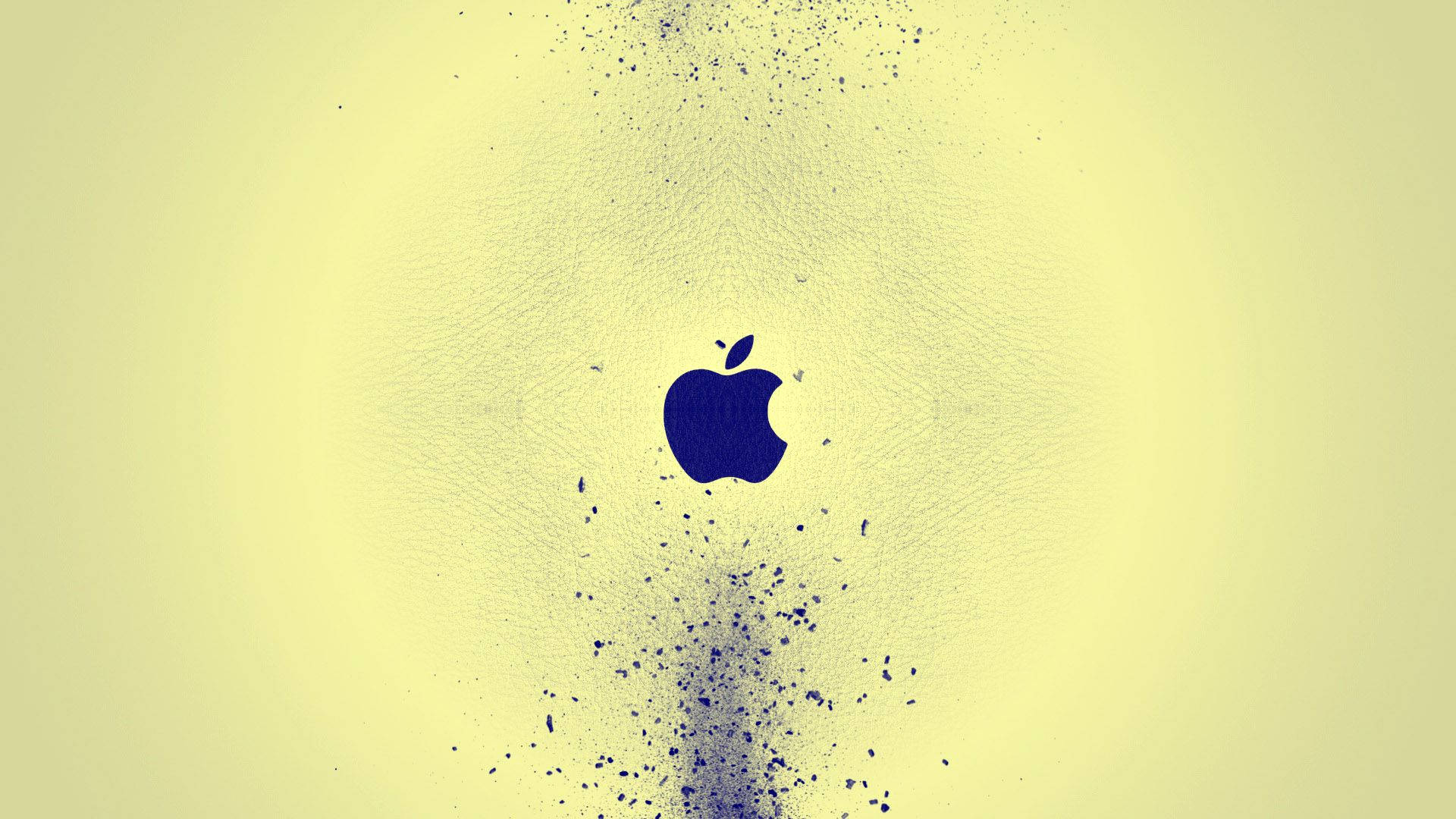MacBook 動態圖片 桌布 壁紙 — 深藍色的Apple標誌在帶有紋理的淡黃色背景上看起來像分解成粒子。