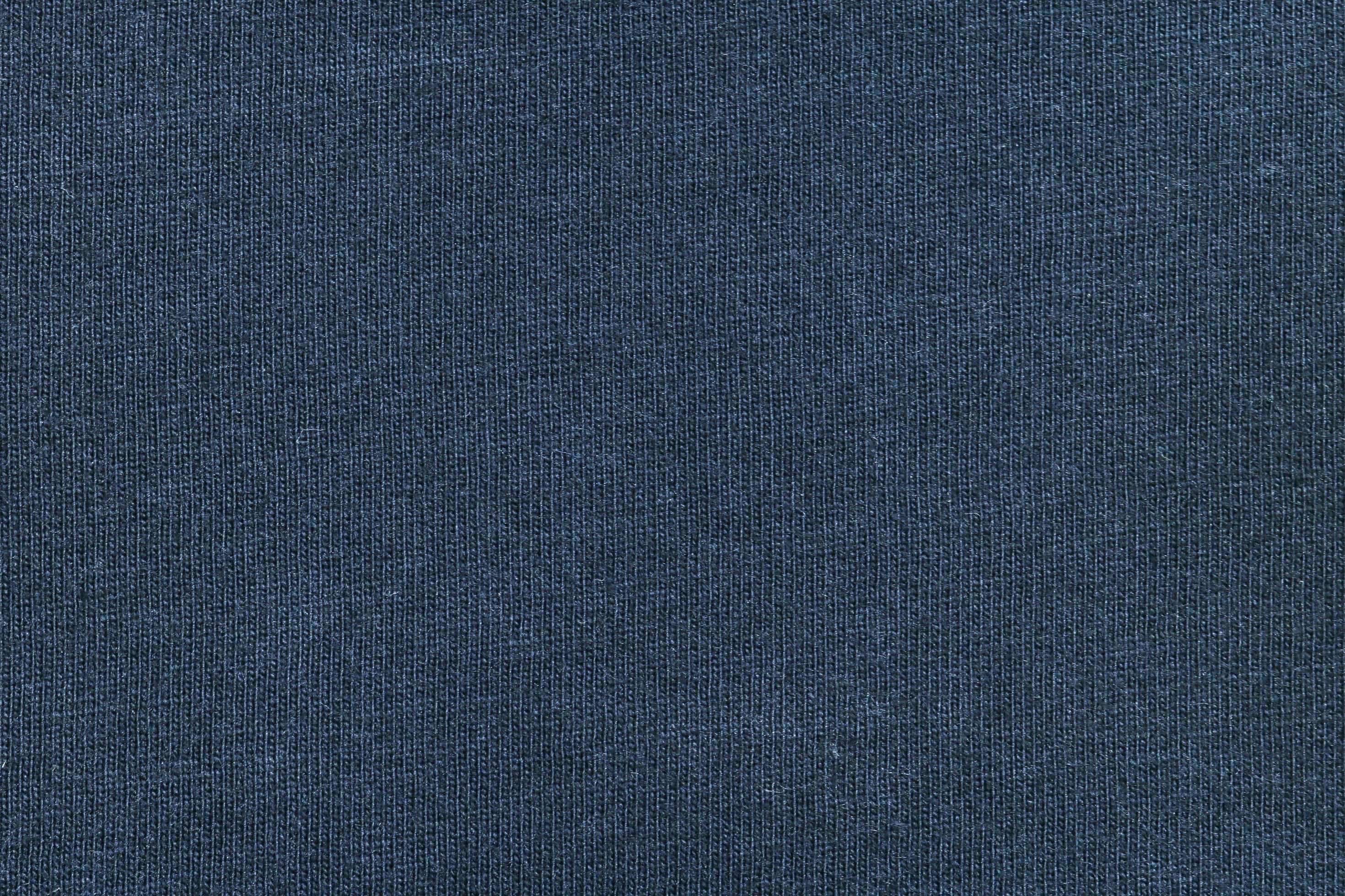 Fabric 桌布 壁紙 — 深藍色織物近距離特寫，具有可見的編織線條和微妙的顏色變化。