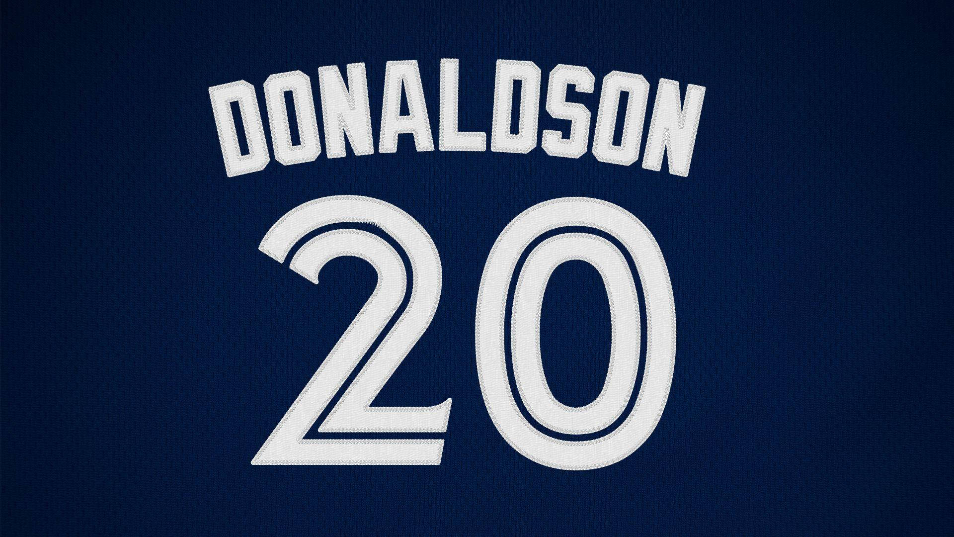 運動 桌布 壁紙 — 深藍色運動球衣的特寫，白色刺繡名字 DONALDSON 和號碼 20。