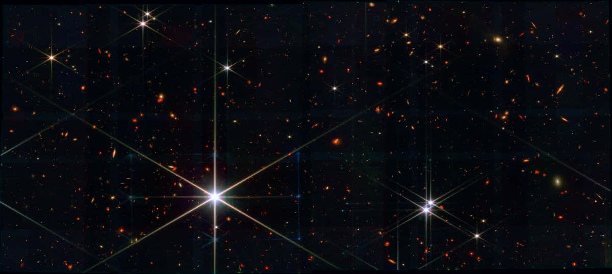 Stars 桌布 壁紙 — 深邃太空景觀，充滿發光的星星和遙遠的星系，背景是黑暗的宇宙。