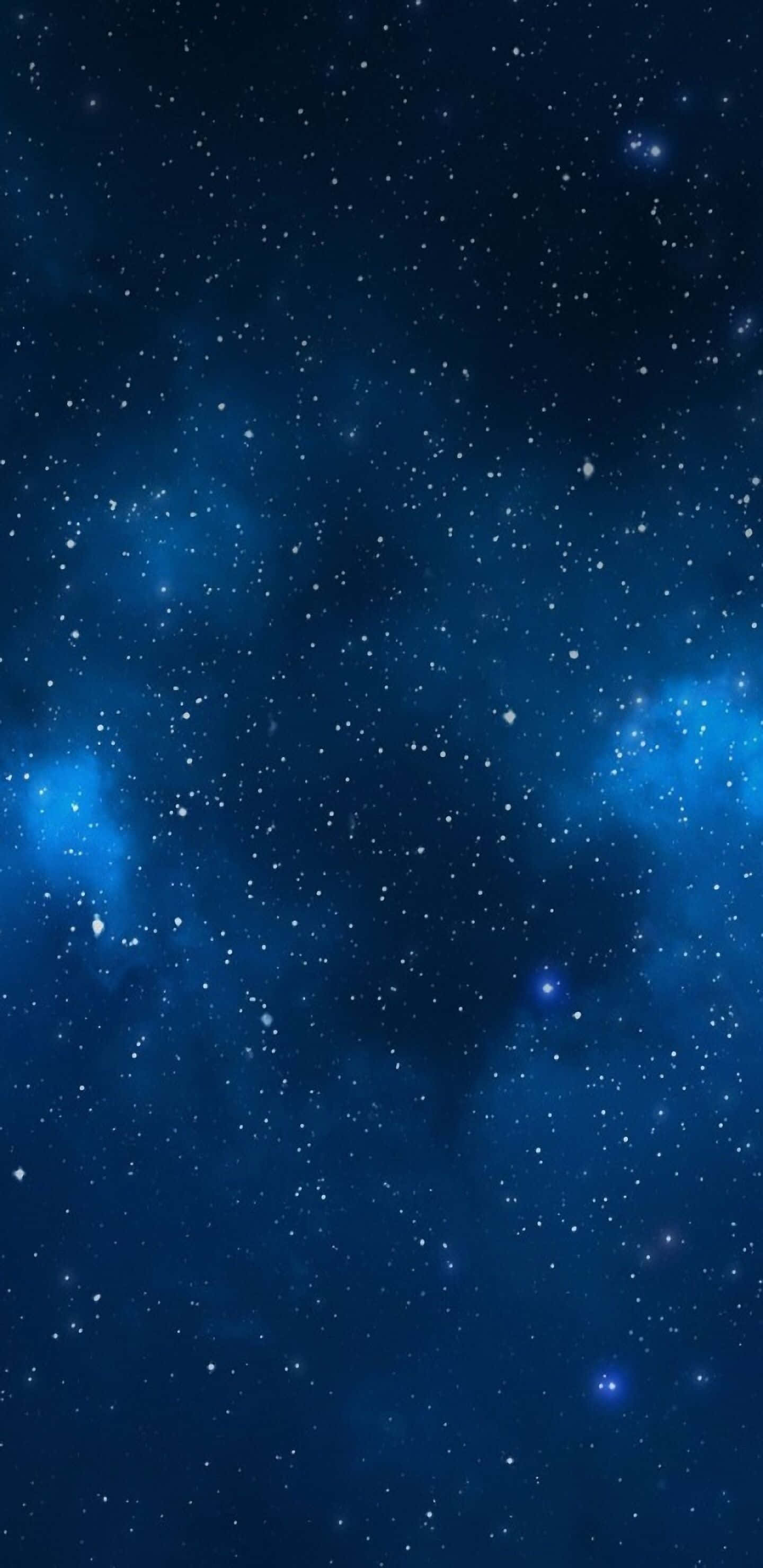 Stars 桌布 壁紙 — 深邃藍色宇宙空間，充滿閃爍星星和發光星雲，襯托著黑暗虛空。