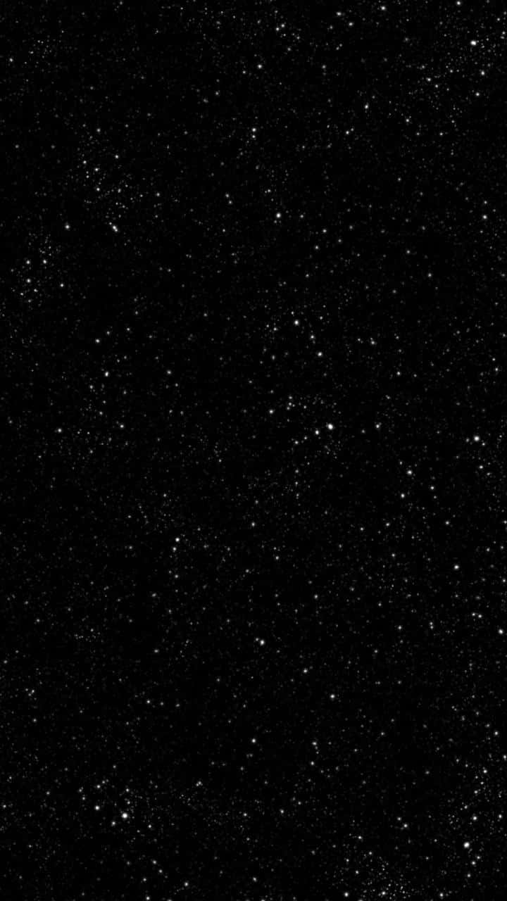 桌布 壁紙 — 深邃黑色夜空中散佈著廣闊的閃爍星場。