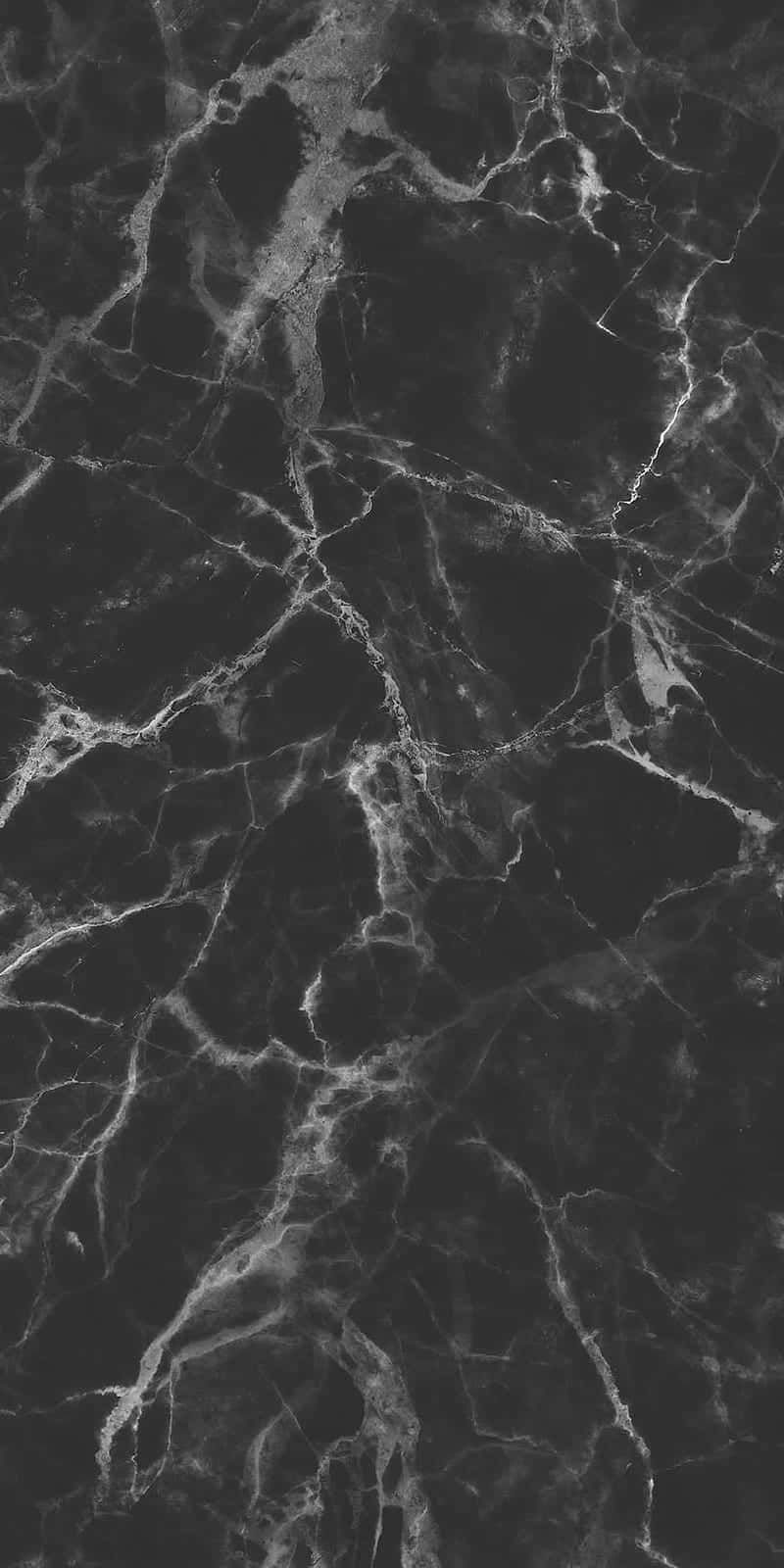 Aesthetic Gray Marble 桌布 壁紙 — 深黑色大理石的特寫，帶有複雜的白色紋理，營造出奢華優雅的質感。