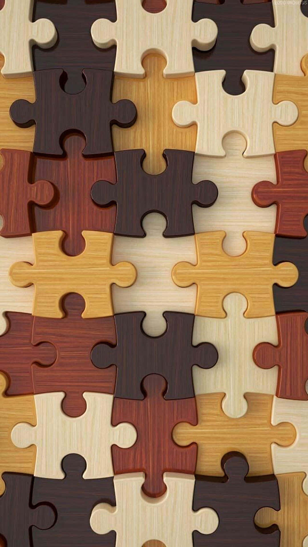 Puzzle 桌布 壁紙 — 淺棕色和深棕色暖色調中相互鎖定的木製拼圖塊的特寫。