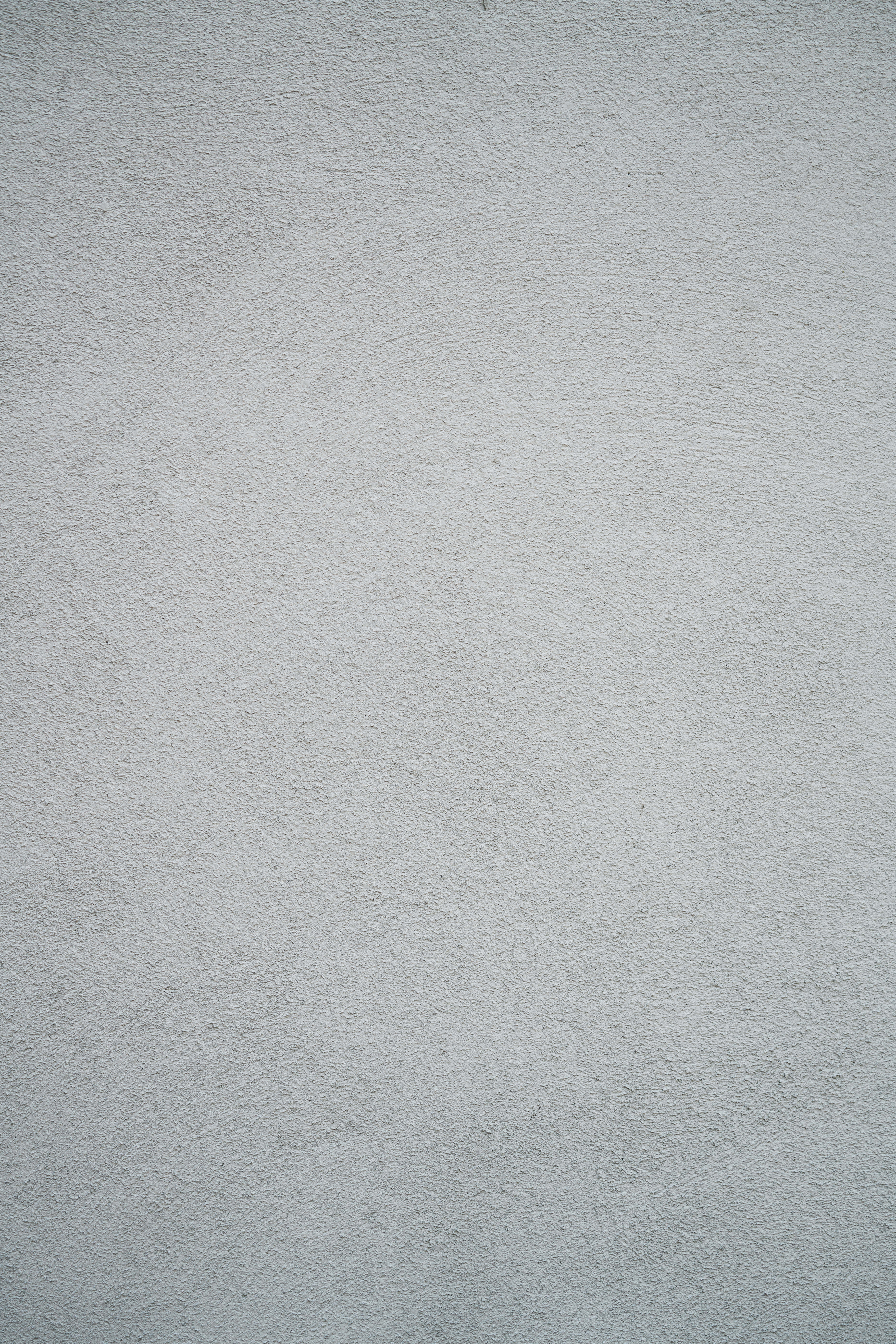 Gray Gradient 桌布 壁紙 — 淺灰色平滑紋理牆面特寫，色調和細微紋理有微妙變化。